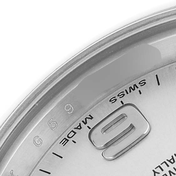 The image shows a close-up of the Rolex Oyster Perpetual 176200 Women's Stainless Steel Silver Dial watch dial, highlighting the 9 o'clock marker and "SWISS MADE" text.