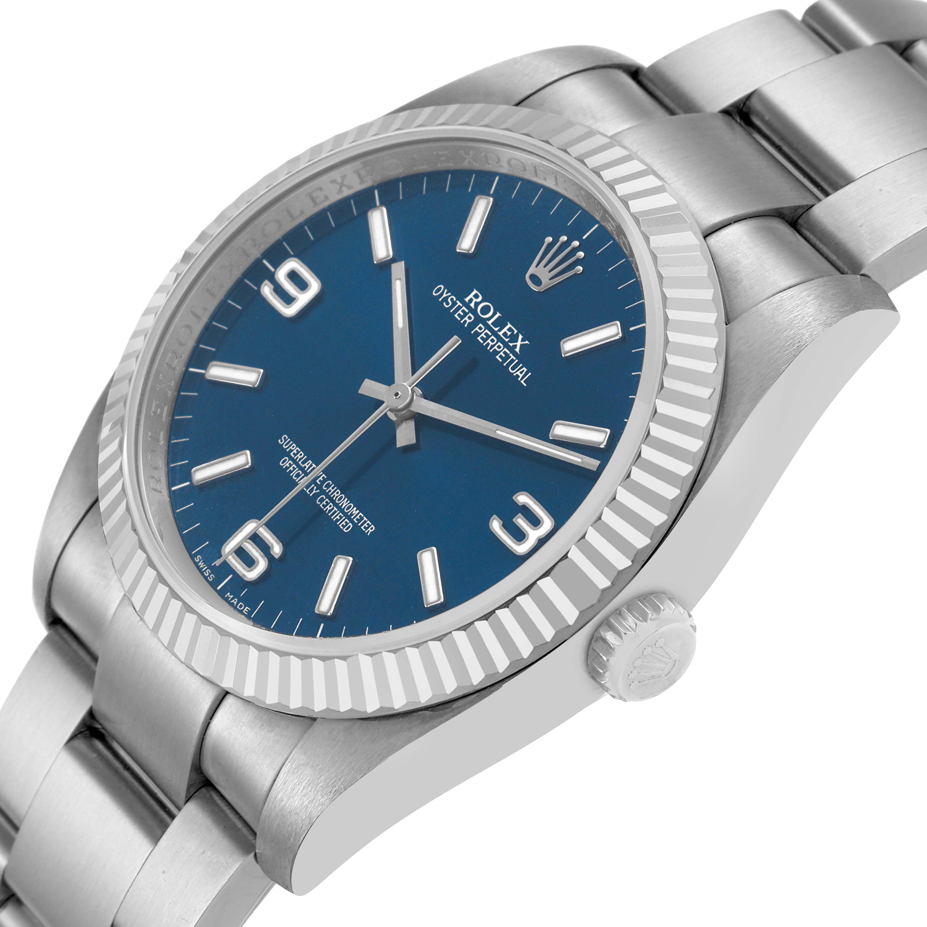 The Rolex Oyster Perpetual 116034 Men's Stainless Steel Blue Dial watch is shown at a three-quarter angle, highlighting the blue dial, fluted bezel, and metal bracelet.