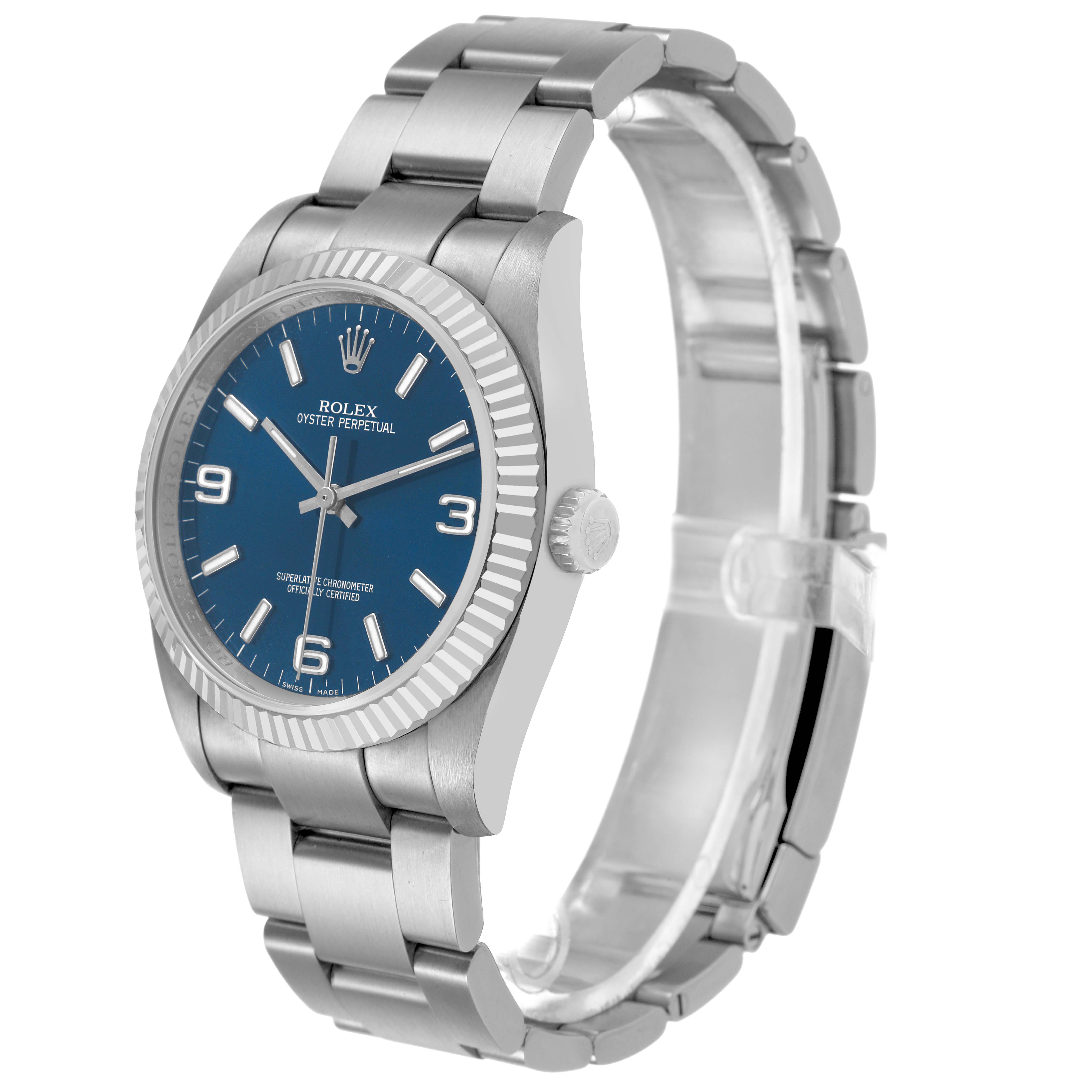 The Rolex Oyster Perpetual 116034 Men's Stainless Steel Blue Dial watch is shown from an angled side view, displaying the face, crown, case, and bracelet.
