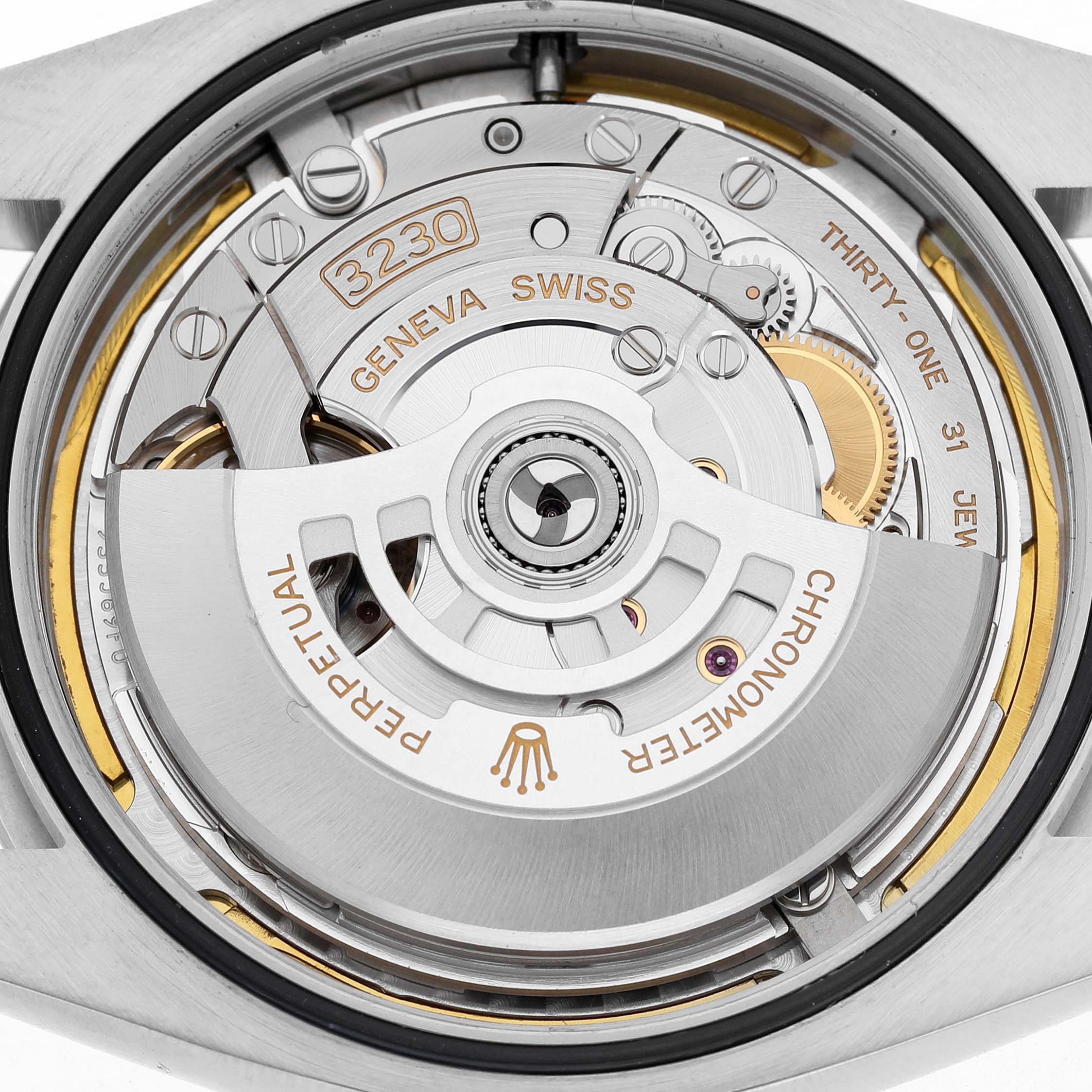The image shows the Rolex Oyster Perpetual 124300 Men's Stainless Steel Green Dial watch movement from the back, highlighting the rotor and mechanical components.