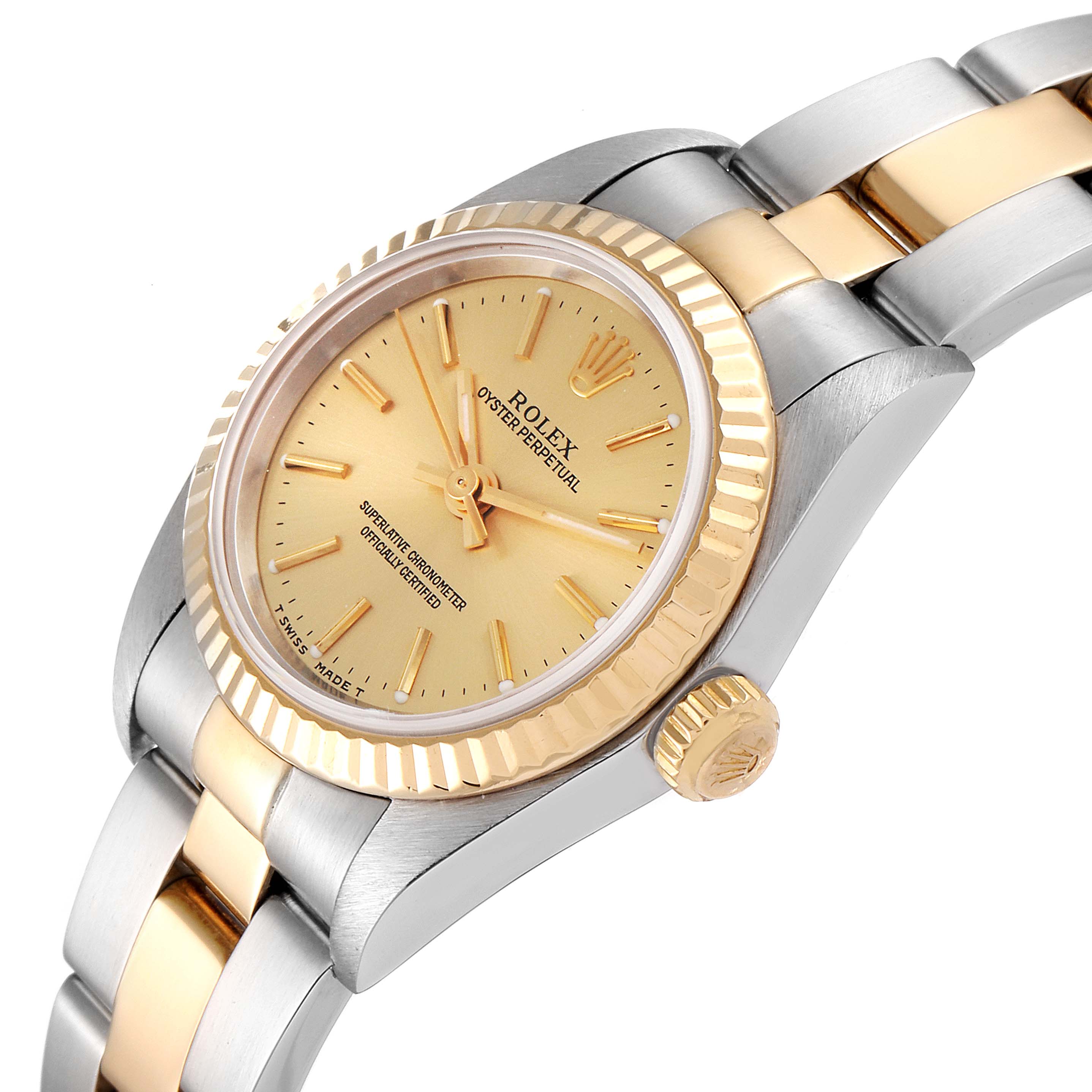 This image shows a side and partial front view of the Rolex Oyster Perpetual 76193 Women's Steel and Gold (two tone) Champagne Dial 76193 Women's Steel and Gold (two tone) Champagne Dial watch, displaying its gold and silver bezel and bracelet.