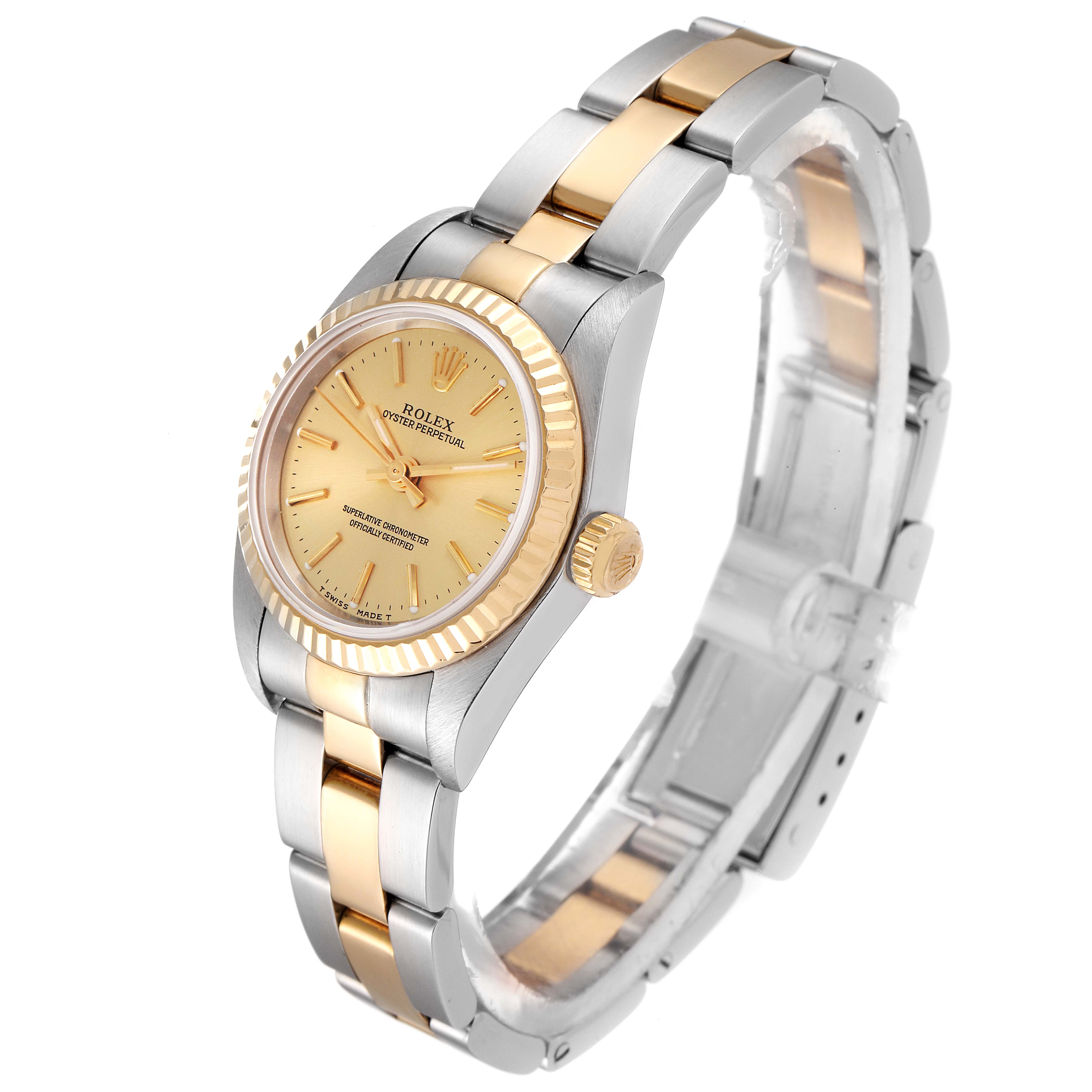 The image shows a side angle of a Rolex Oyster Perpetual 76193 Women's Steel and Gold (two tone) Champagne Dial 76193 Women's Steel and Gold (two tone) Champagne Dial watch, highlighting the face, bezel, crown, and bracelet.