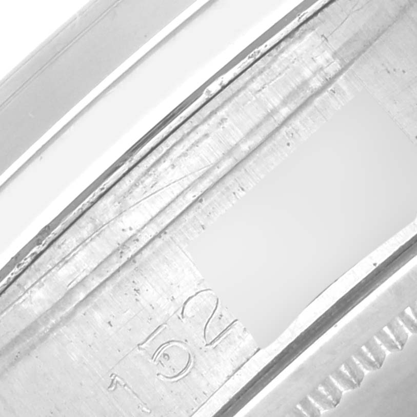 The image shows a close-up angle of the serial number engraved on the casing of a Rolex Vintage Collection 6694 Men's Stainless Steel Silver Dial 6694 Men's Stainless Steel Silver Dial watch.