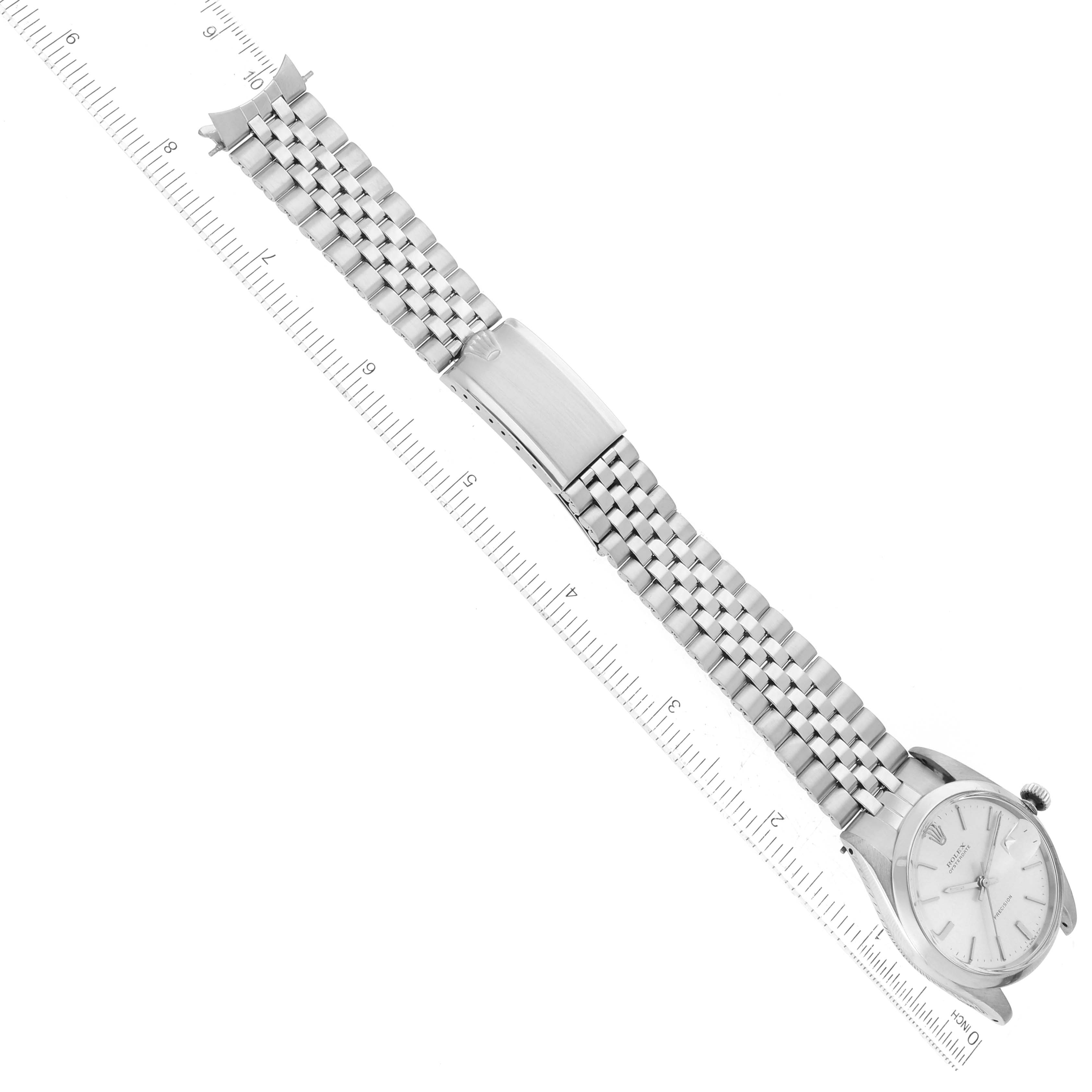 The image shows a top-down view of a Rolex Vintage Collection 6694 Men's Stainless Steel Silver Dial 6694 Men's Stainless Steel Silver Dial watch, highlighting its face and metal bracelet with a clasp.