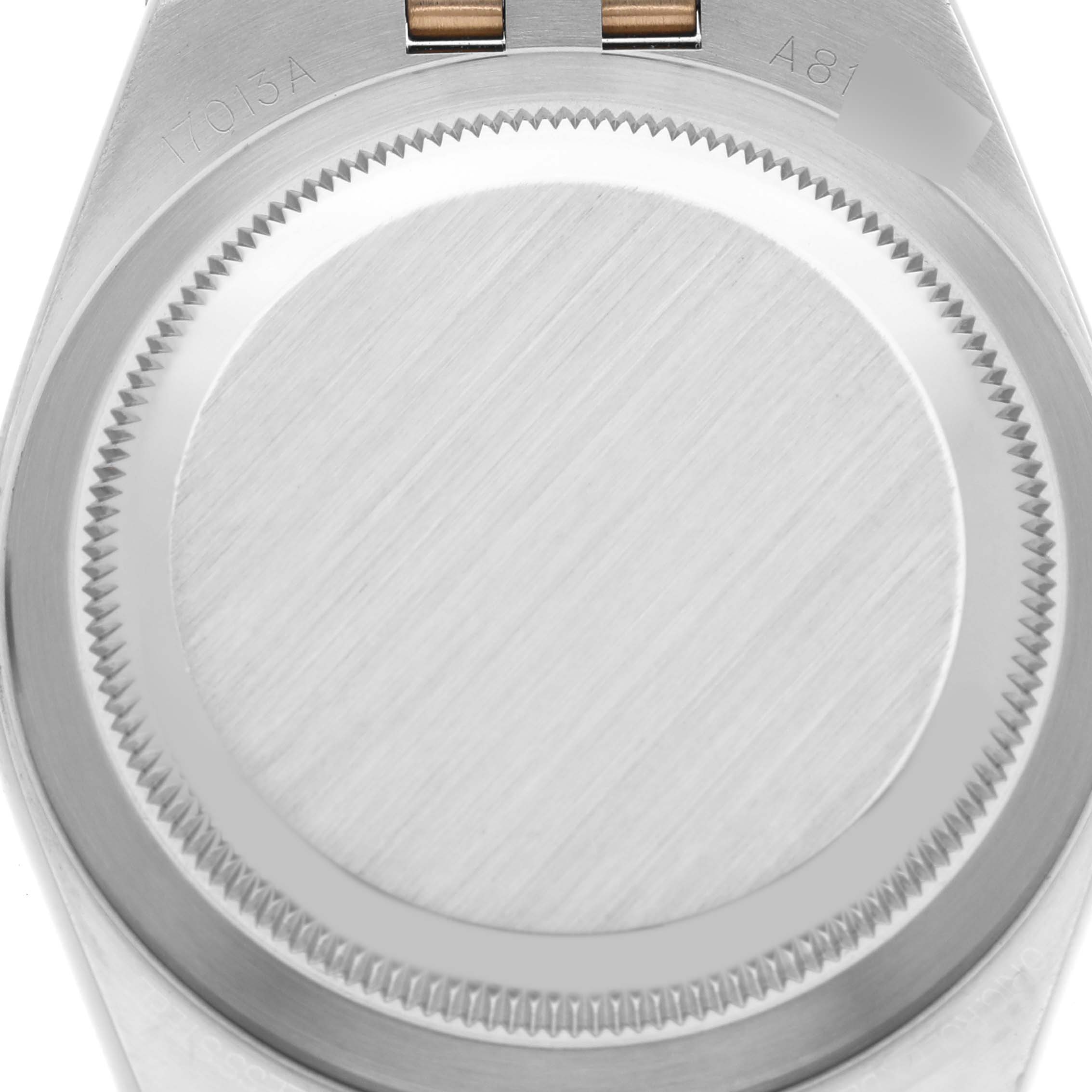 This image shows the case back of a Rolex Oysterquartz 17013 Men's Steel and Gold (two tone) Champagne Dial 17013 Men's Steel and Gold (two tone) Champagne Dial watch, viewed from the top.