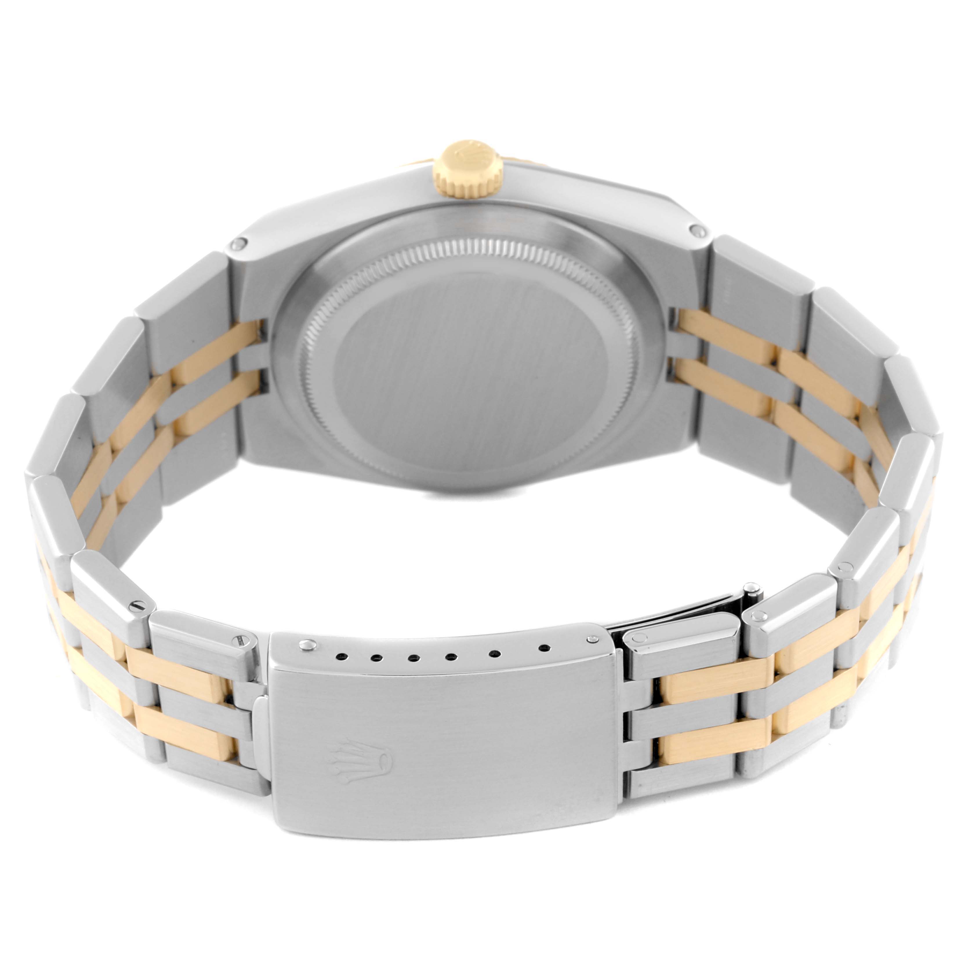 This image shows the back case and bracelet of a Rolex Oysterquartz 17013 Men's Steel and Gold (two tone) Champagne Dial 17013 Men's Steel and Gold (two tone) Champagne Dial watch, featuring a stainless steel and gold finish.