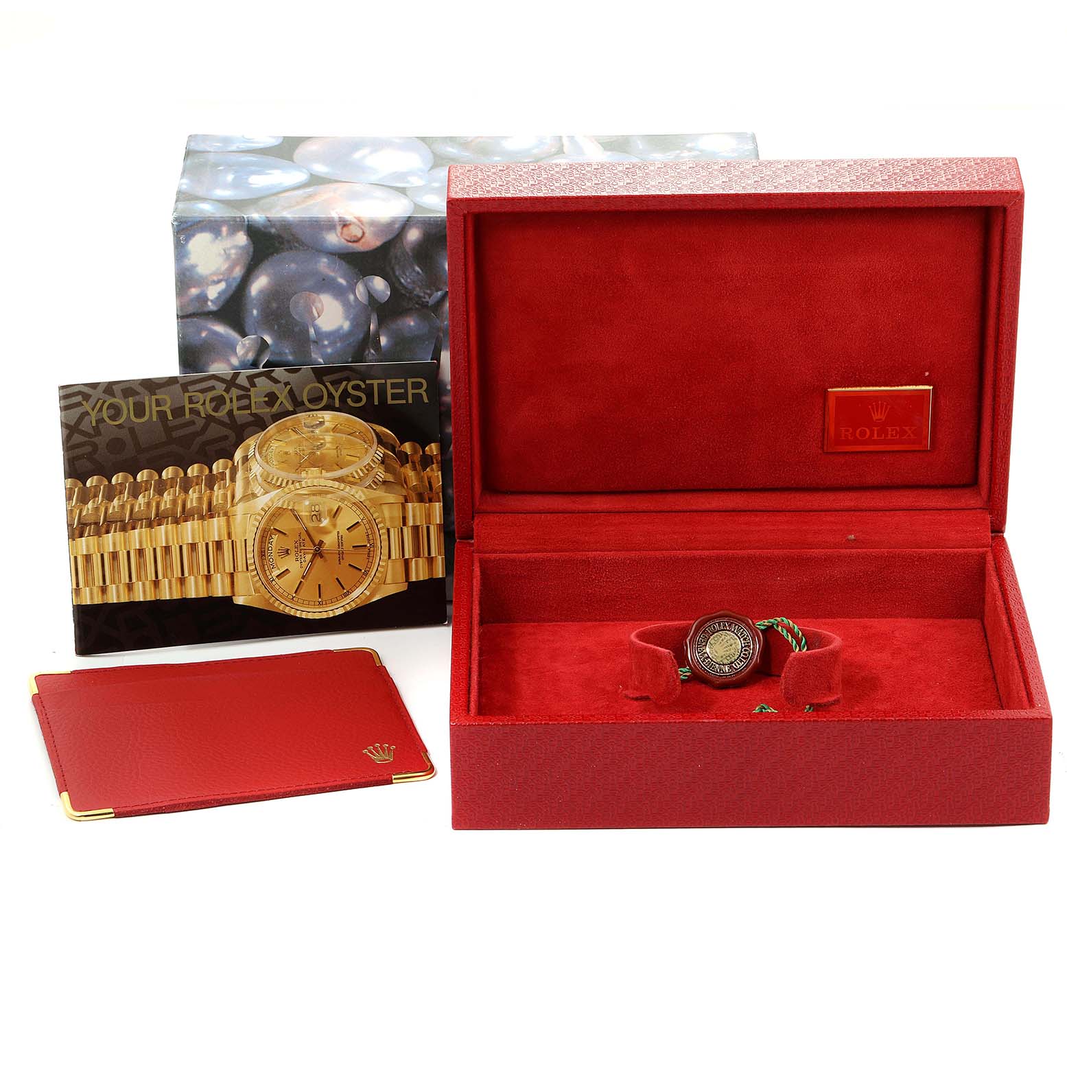 The image shows a Rolex President 69158 Women
s Yellow Gold Champagne Dial 69158 Women
s Yellow Gold Champagne Dial model watch with its box, booklet, and accessories from a front angle.