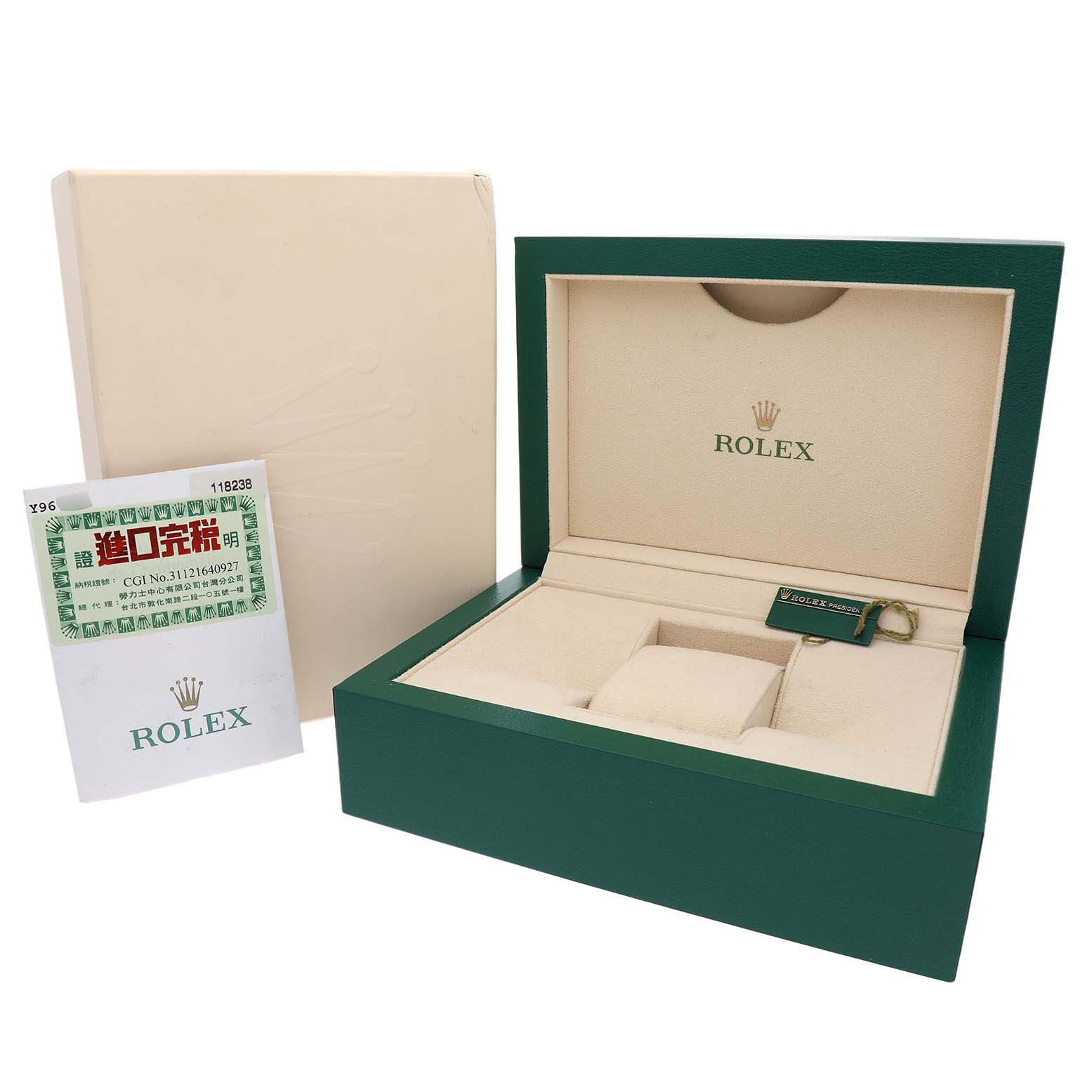The image shows an open Rolex box for a President model, with a card and tag, viewed from the top.
