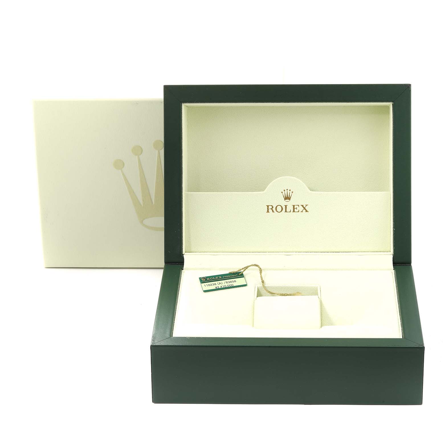 The image shows an open Rolex watch box for the President model, with tags inside.