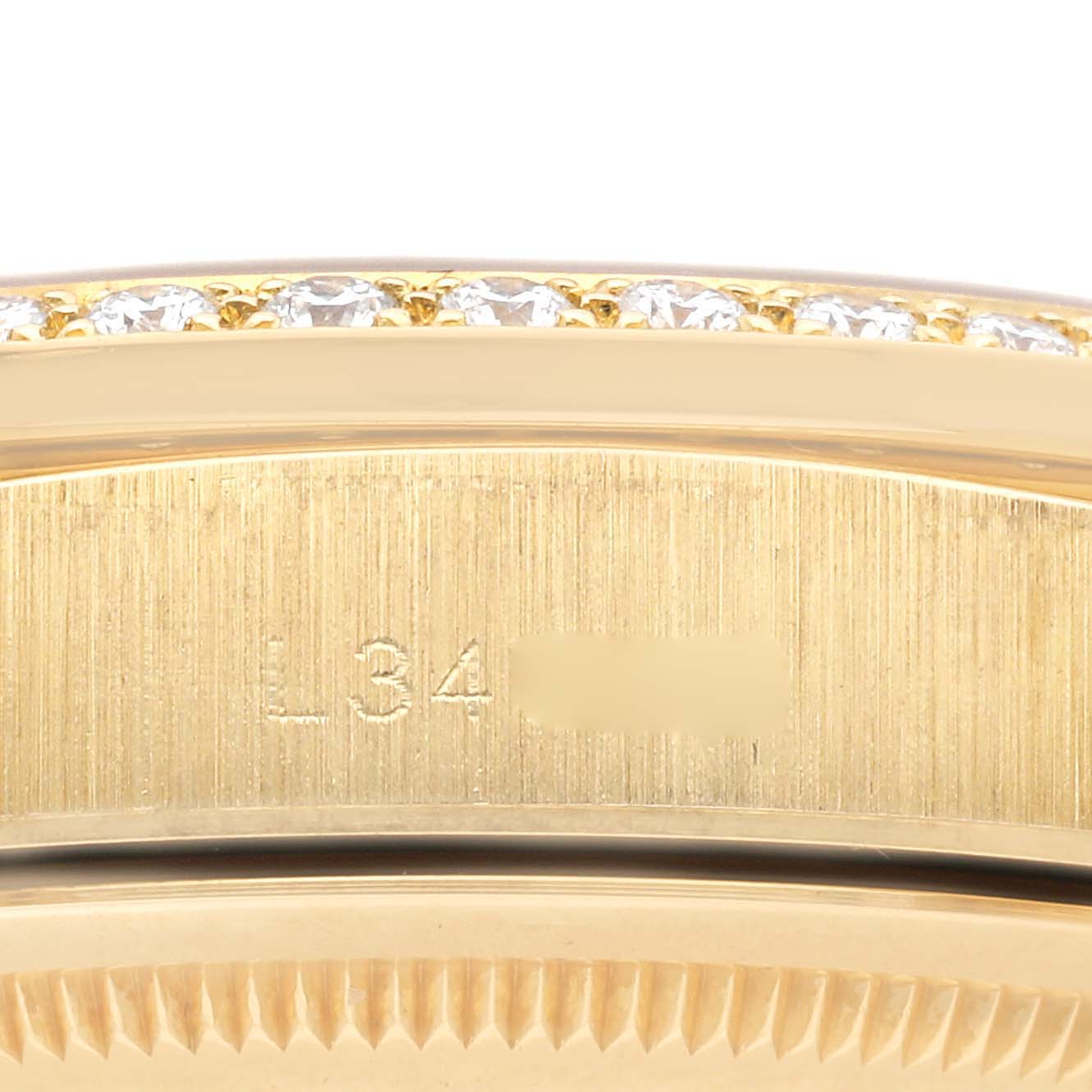 The image shows a close-up of a Rolex President 18388 Men
s Yellow Gold Grey Dial 18388 Men
s Yellow Gold Grey Dial model with visible diamonds set in the bezel and part of the case.