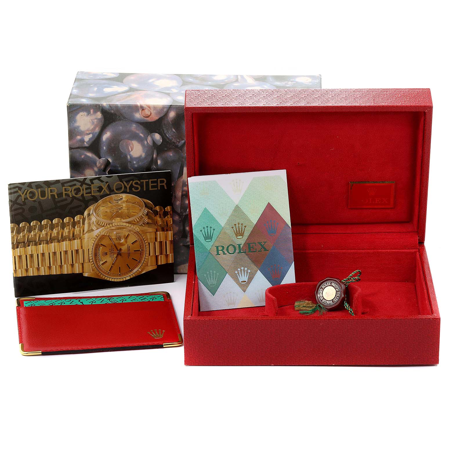 The image shows the box, tags, booklet, and accessories for the President model by Rolex.