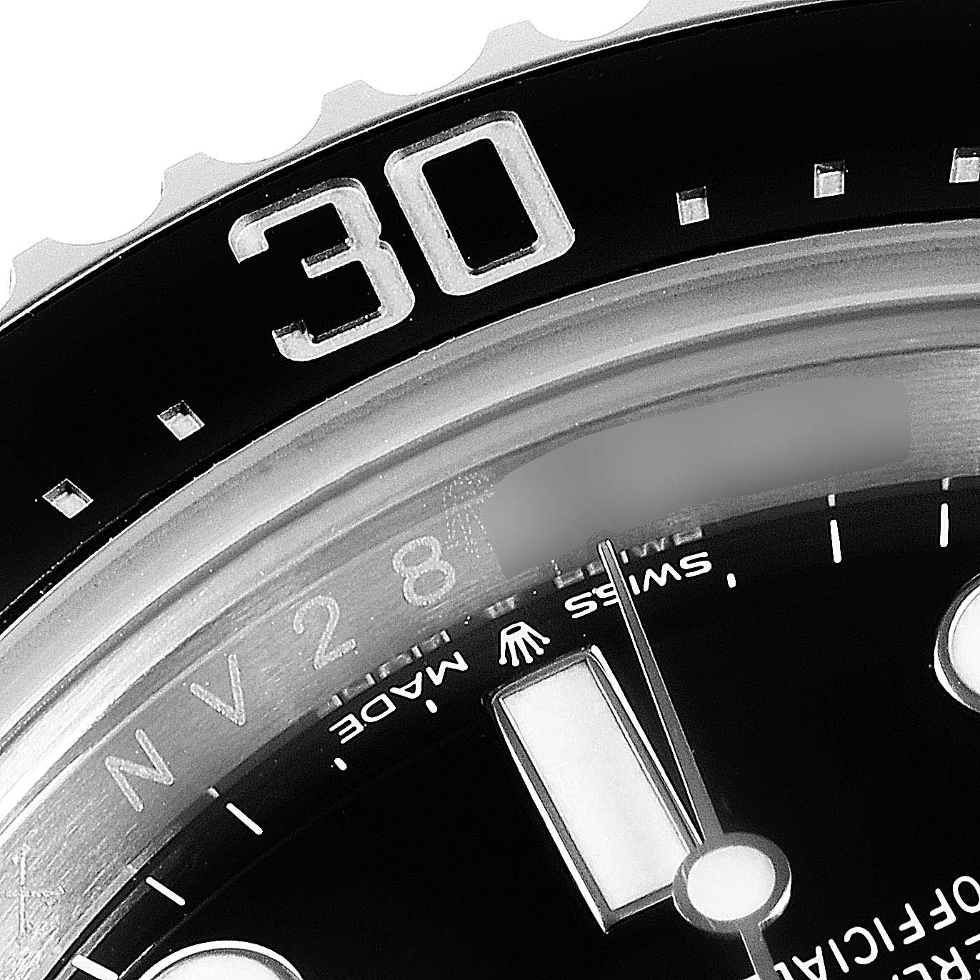 The image shows a close-up view of the bezel and dial of a Rolex Sea-Dweller 126600 Men
s Stainless Steel Black Dial 126600 Men
s Stainless Steel Black Dial watch, focusing on the 30-minute marker and the surrounding area.
