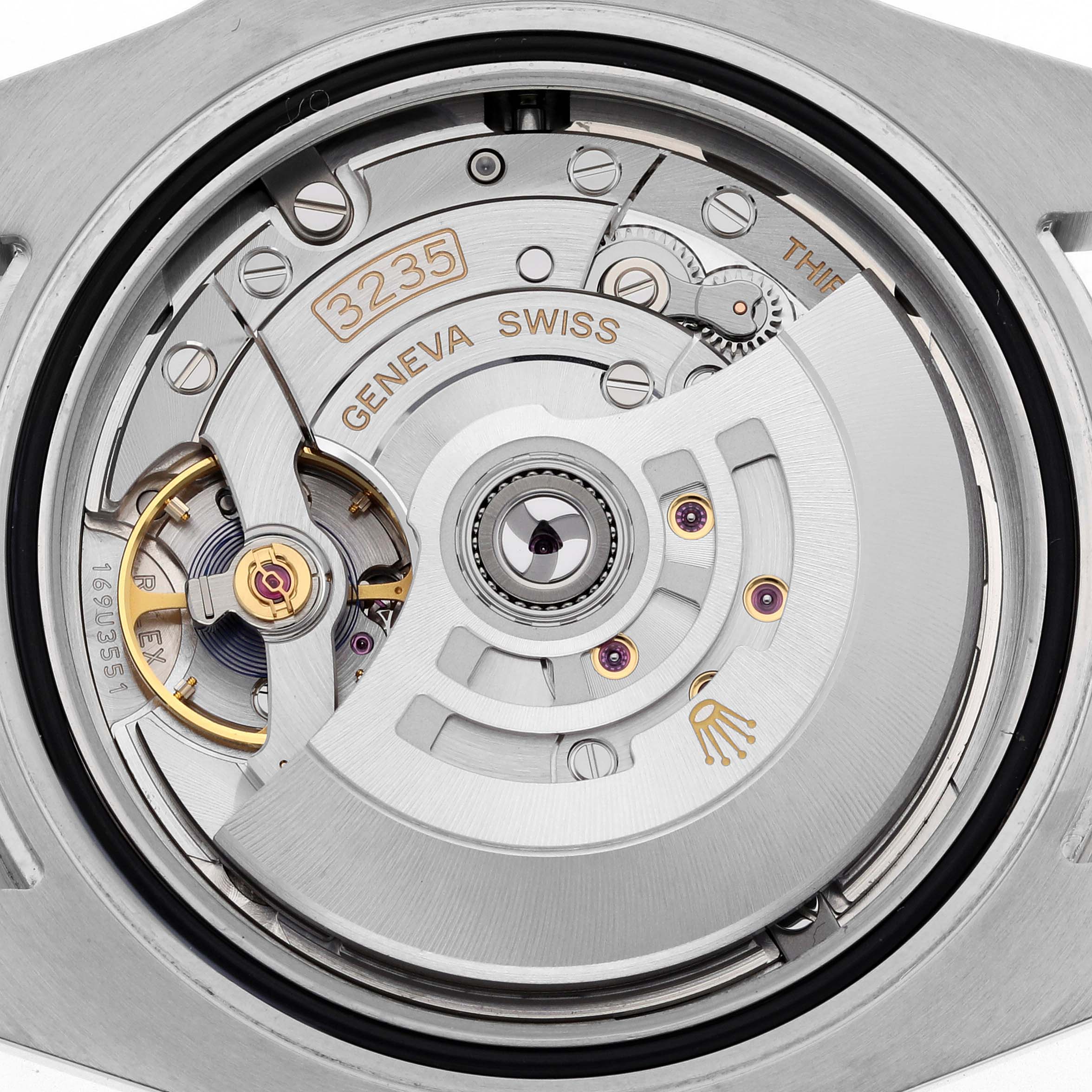 This image shows the inner movement mechanism of a Rolex Submariner 126613LB Men's Steel and Gold (two tone) Blue Dial 126613LB Men's Steel and Gold (two tone) Blue Dial watch, highlighting its intricate gears and components.