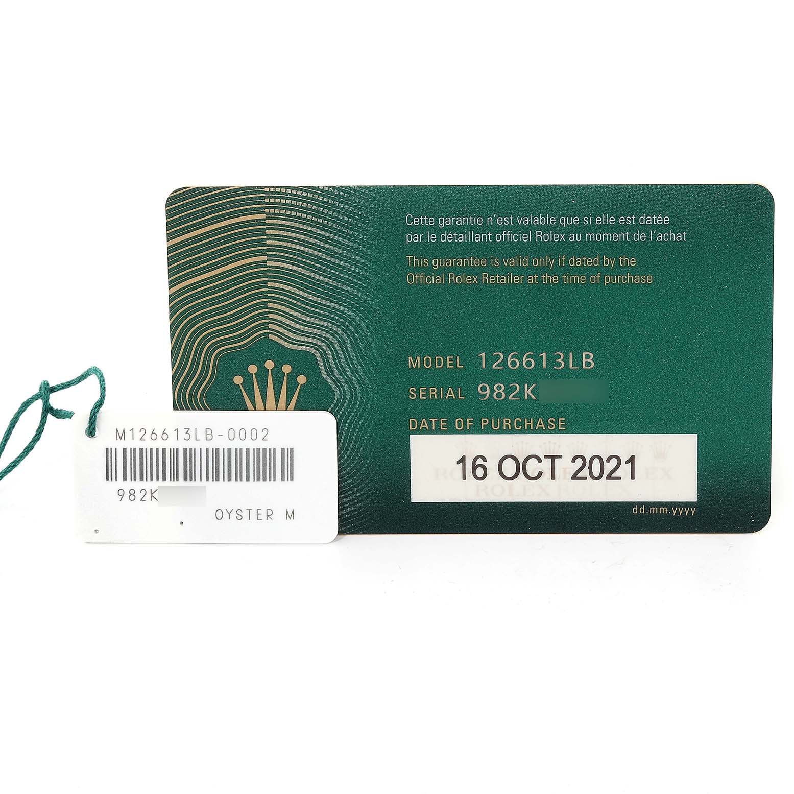 This image shows a warranty card and a serial number tag for a Rolex Submariner 126613LB Men's Steel and Gold (two tone) Blue Dial 126613LB Men's Steel and Gold (two tone) Blue Dial model 126613LB, dated 16 OCT 2021.