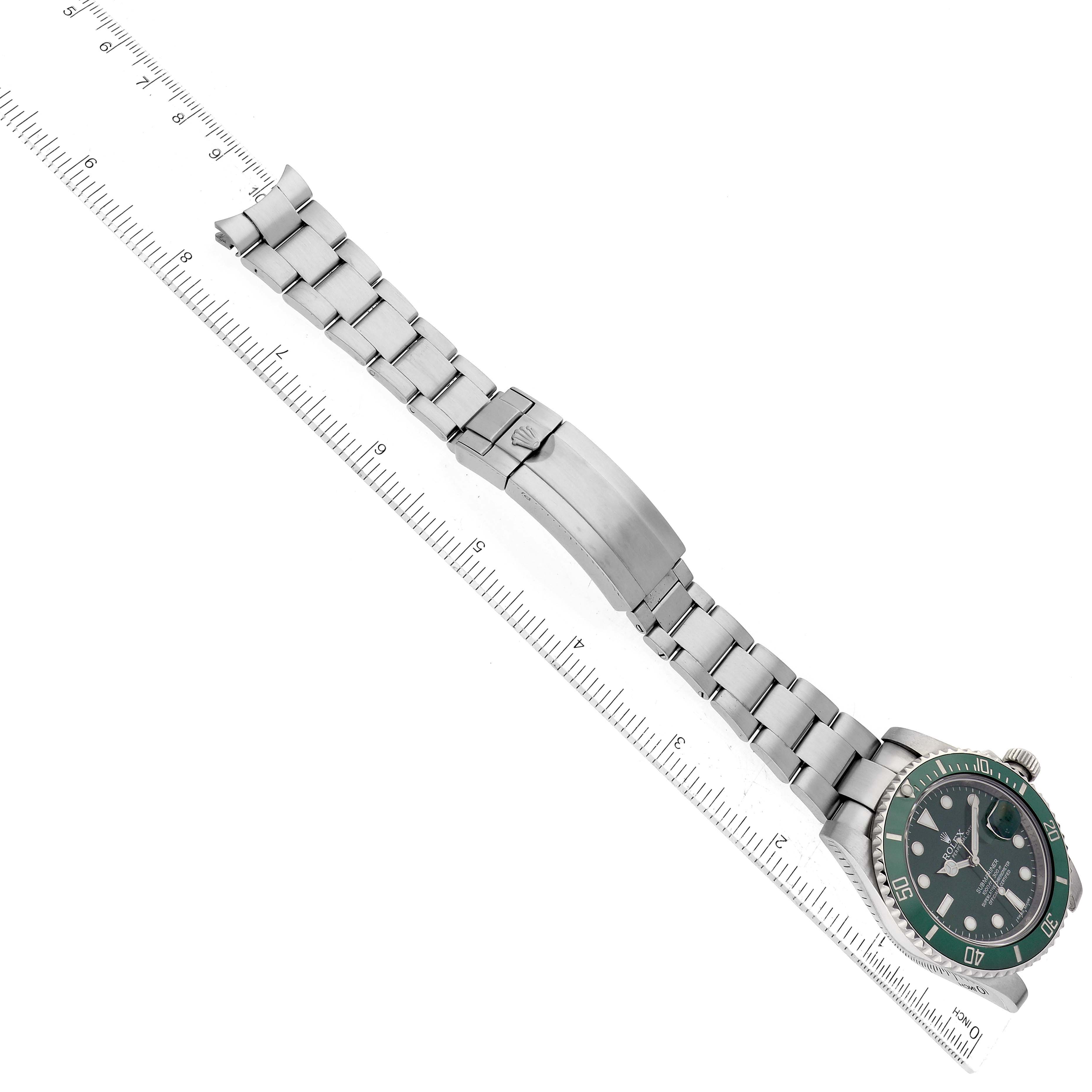 The image shows a Rolex Submariner 116610LV Men's Stainless Steel Green Dial 116610LV Men's Stainless Steel Green Dial watch on its side, highlighting the bracelet and the case with a green bezel and dial.