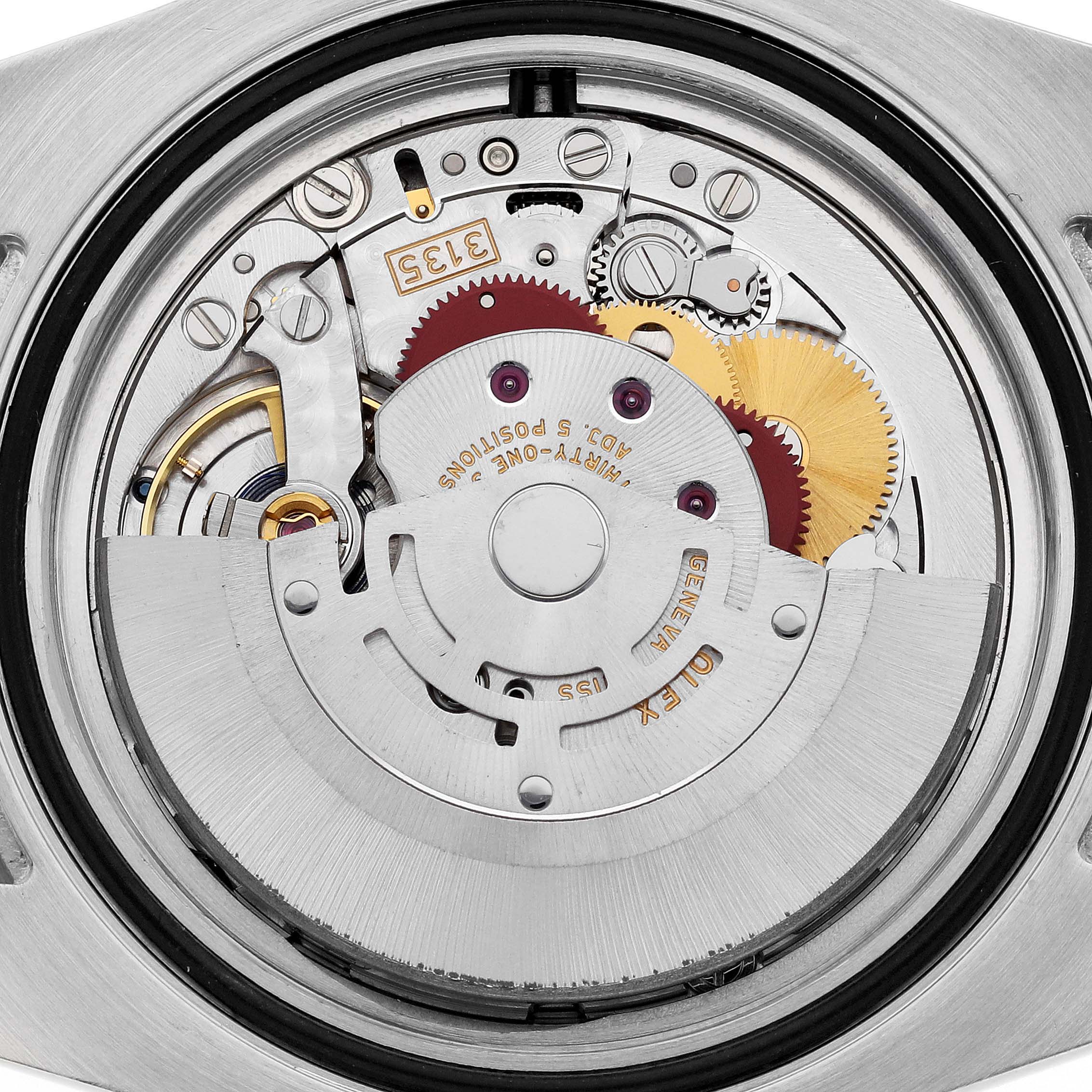 This image shows the internal mechanism of the Rolex Submariner 116610LV Men's Stainless Steel Green Dial 116610LV Men's Stainless Steel Green Dial watch from a rear, close-up angle.
