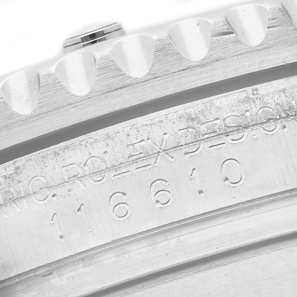 This image shows a close-up angle of the engraved case side and bezel of a Rolex Submariner 116610LV Men's Stainless Steel Green Dial 116610LV Men's Stainless Steel Green Dial model with some visible serial numbers.