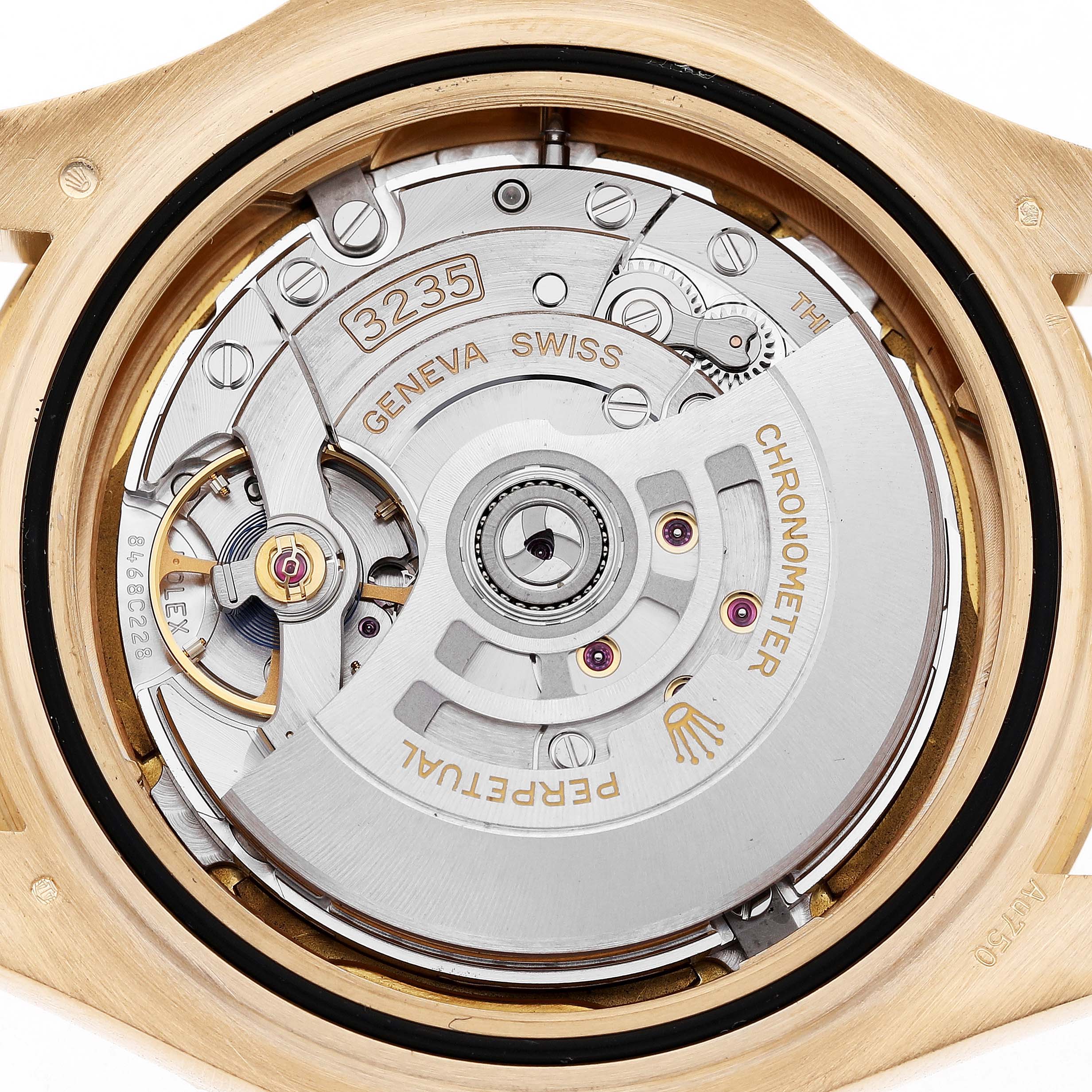 The image shows the back view of a Rolex Yacht-Master 226658 Men's Yellow Gold Black Dial watch, highlighting its intricate movement mechanism.