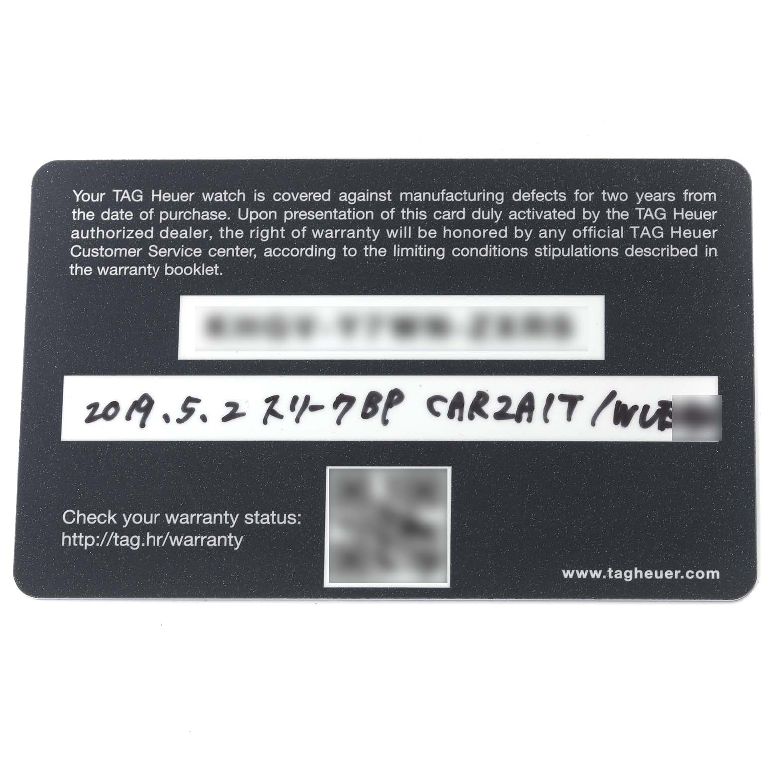 The image shows a warranty card for a Tag Heuer Carrera CAR2A1T.FT6052 Men's Titanium Black Dial CAR2A1T.FT6052 Men's Titanium Black Dial watch, with text and handwritten details.