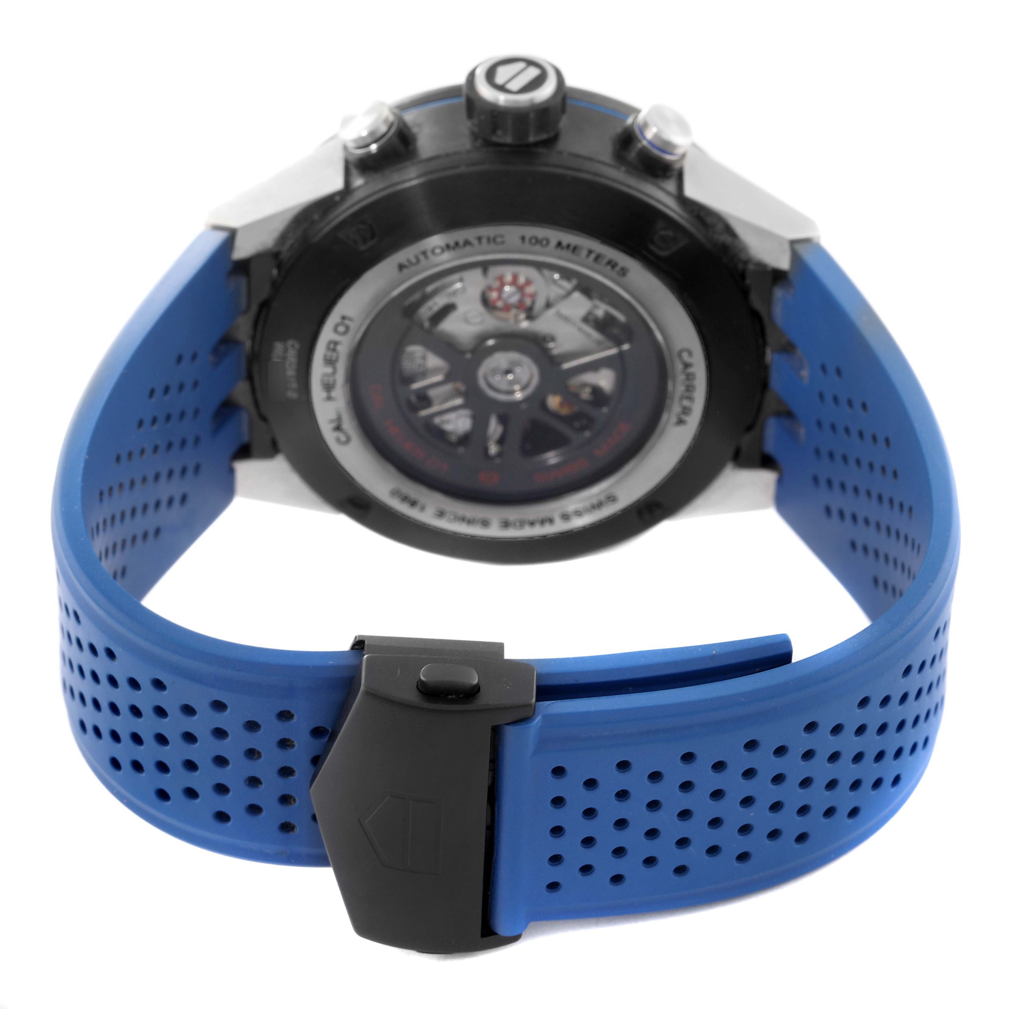 This image shows the back of a Tag Heuer Carrera CAR2A1T.FT6052 Men's Titanium Black Dial CAR2A1T.FT6052 Men's Titanium Black Dial watch, displaying its inner mechanism and blue perforated strap.