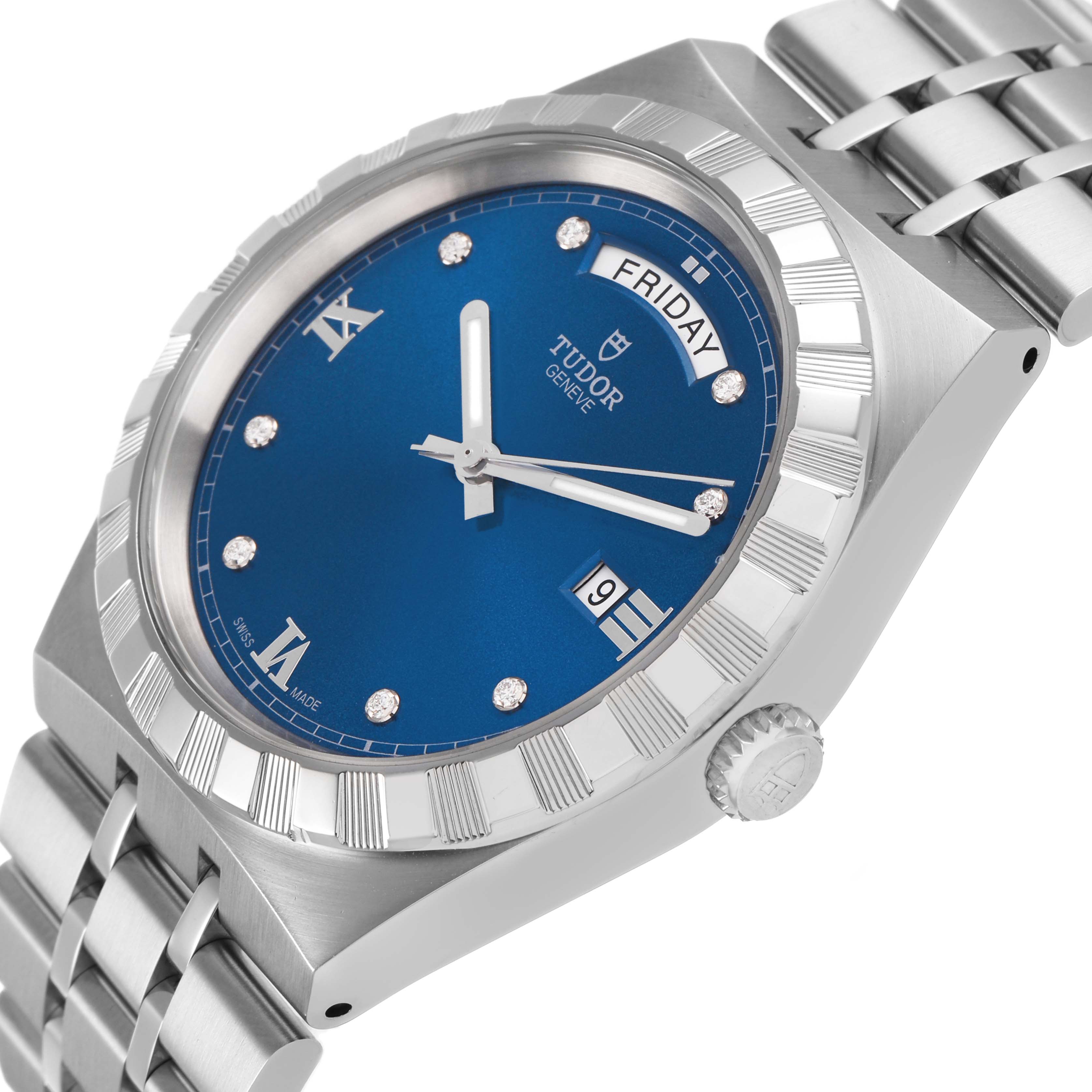 The Tudor Royal 28600 Men's Stainless Steel Blue Dial watch is shown from an angled side view, highlighting its blue dial, fluted bezel, stainless steel bracelet, and crown.