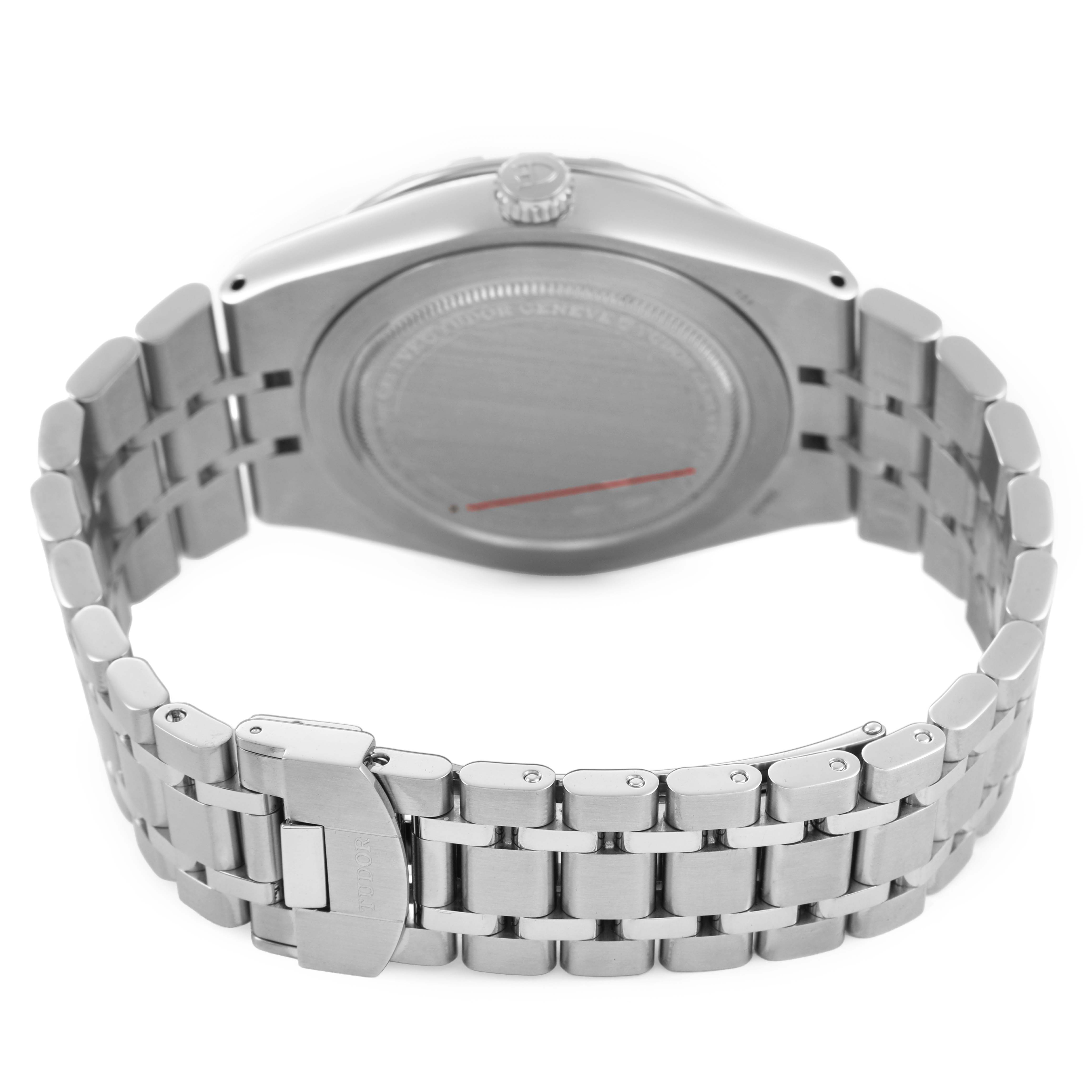 The Tudor Royal 28600 Men's Stainless Steel Blue Dial watch is shown from the back, highlighting the case back, crown, and metal bracelet with a clasp.