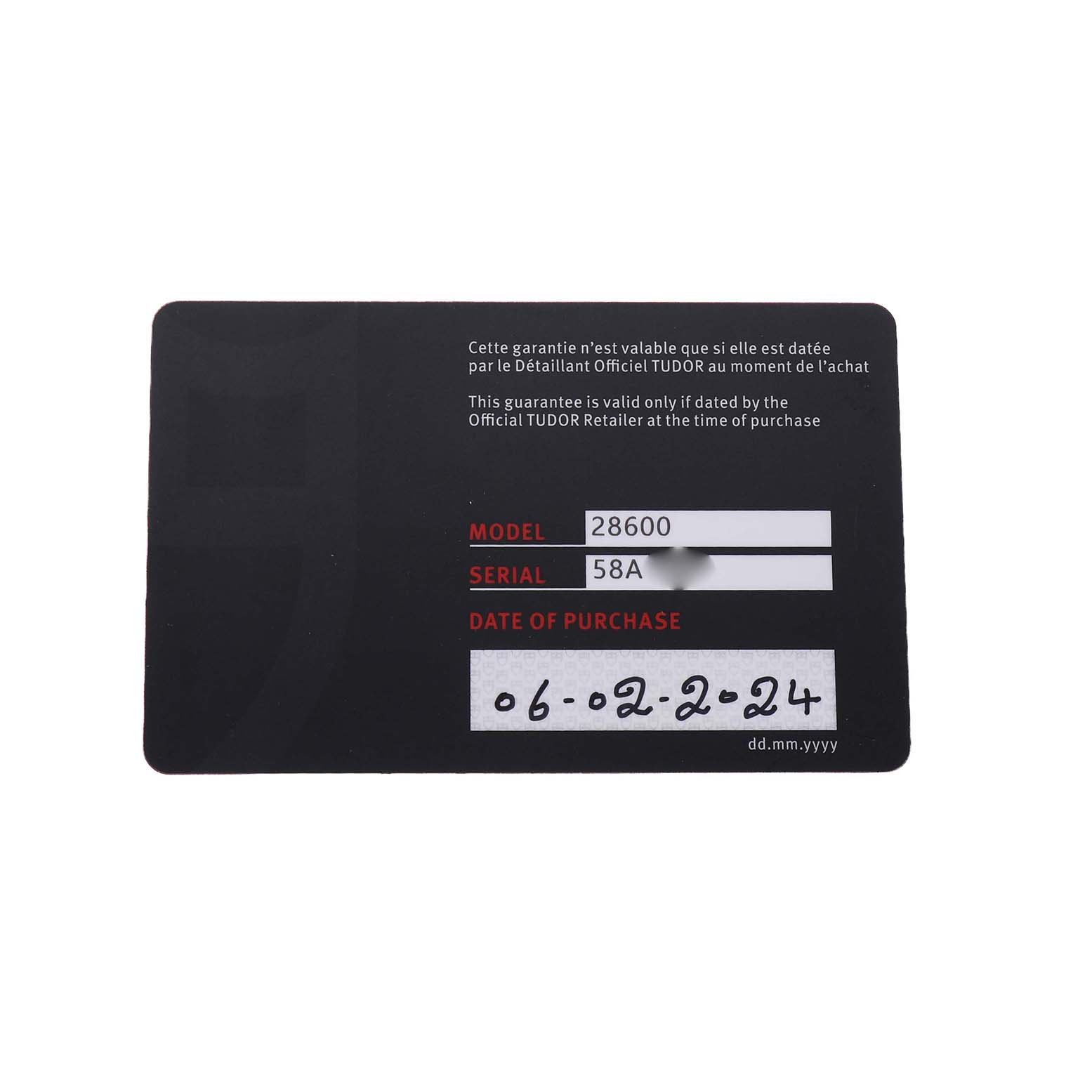 This image shows the warranty card for a Tudor Royal 28600 Men's Stainless Steel Blue Dial watch model 28600 at a straight angle.