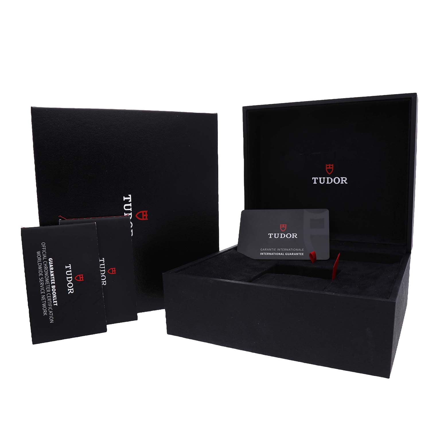 The image shows the Tudor Royal 28600 Men's Stainless Steel Blue Dial watch box, warranty card, and documentation from a front angle.