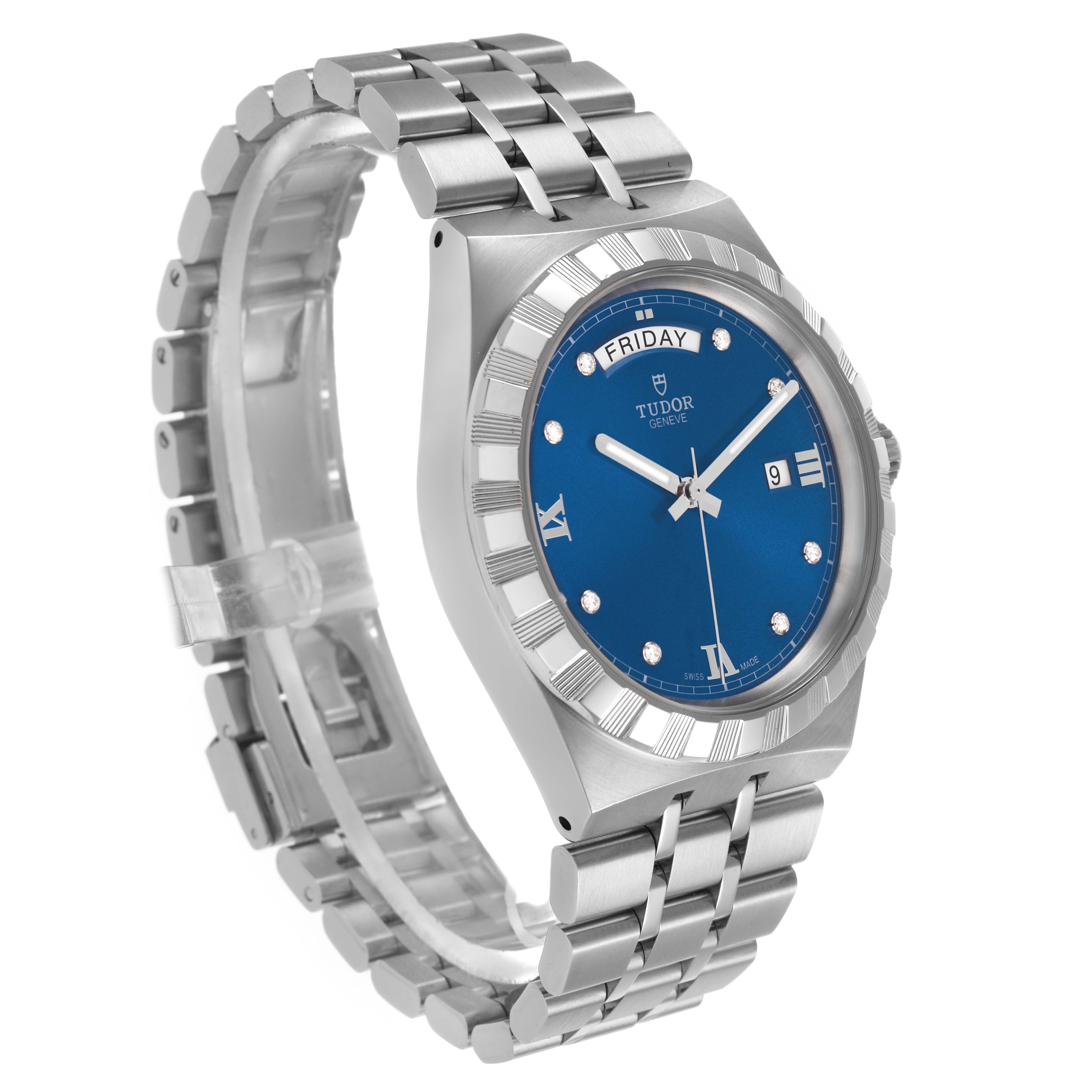 The Tudor Royal 28600 Men's Stainless Steel Blue Dial watch is shown from a front-left angle, highlighting the blue dial, bracelet, and fluted bezel.