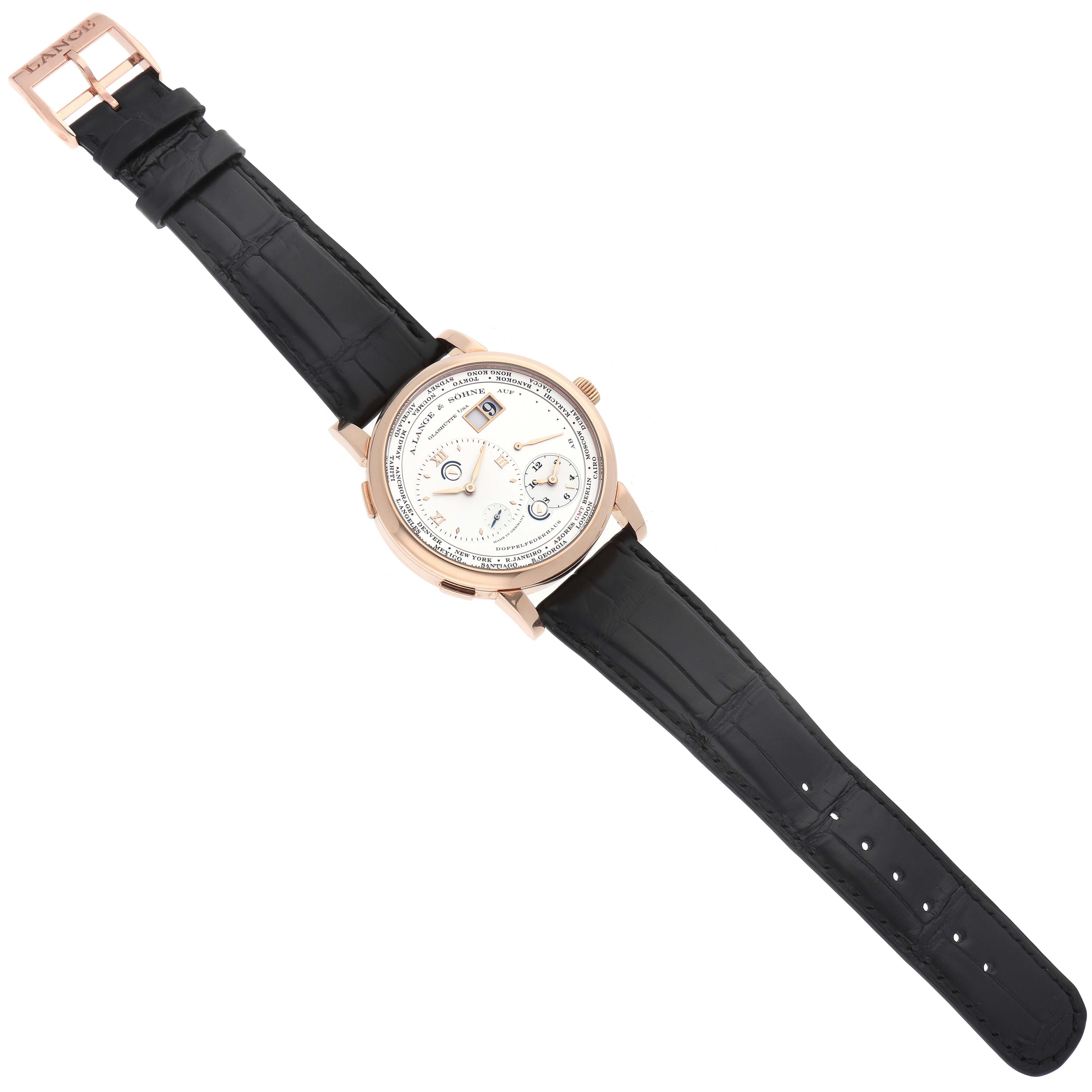 The image shows an A. Lange 
Sohne Lange 1 116.032 Men
s Rose Gold Silver Dial watch laid flat, displaying the face, strap, and buckle at a slight angle.