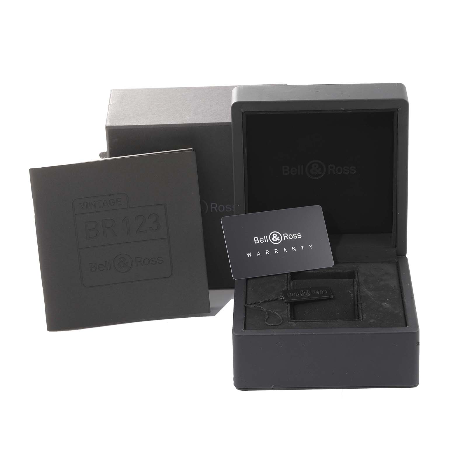 The image shows the box, warranty card, and packaging of a Bell & Ross Vintage BRV123-ST-HER/SRB Men's Stainless Steel Black Dial BRV123-ST-HER/SRB Men's Stainless Steel Black Dial model BR123 watch from a front angle.
