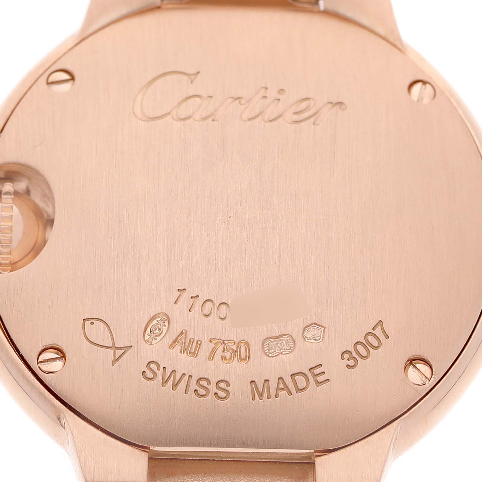 The image shows the back of a Cartier Ballon Bleu WE9002Z3 Women's Rose Gold Silver Dial watch, highlighting engravings and hallmarks.