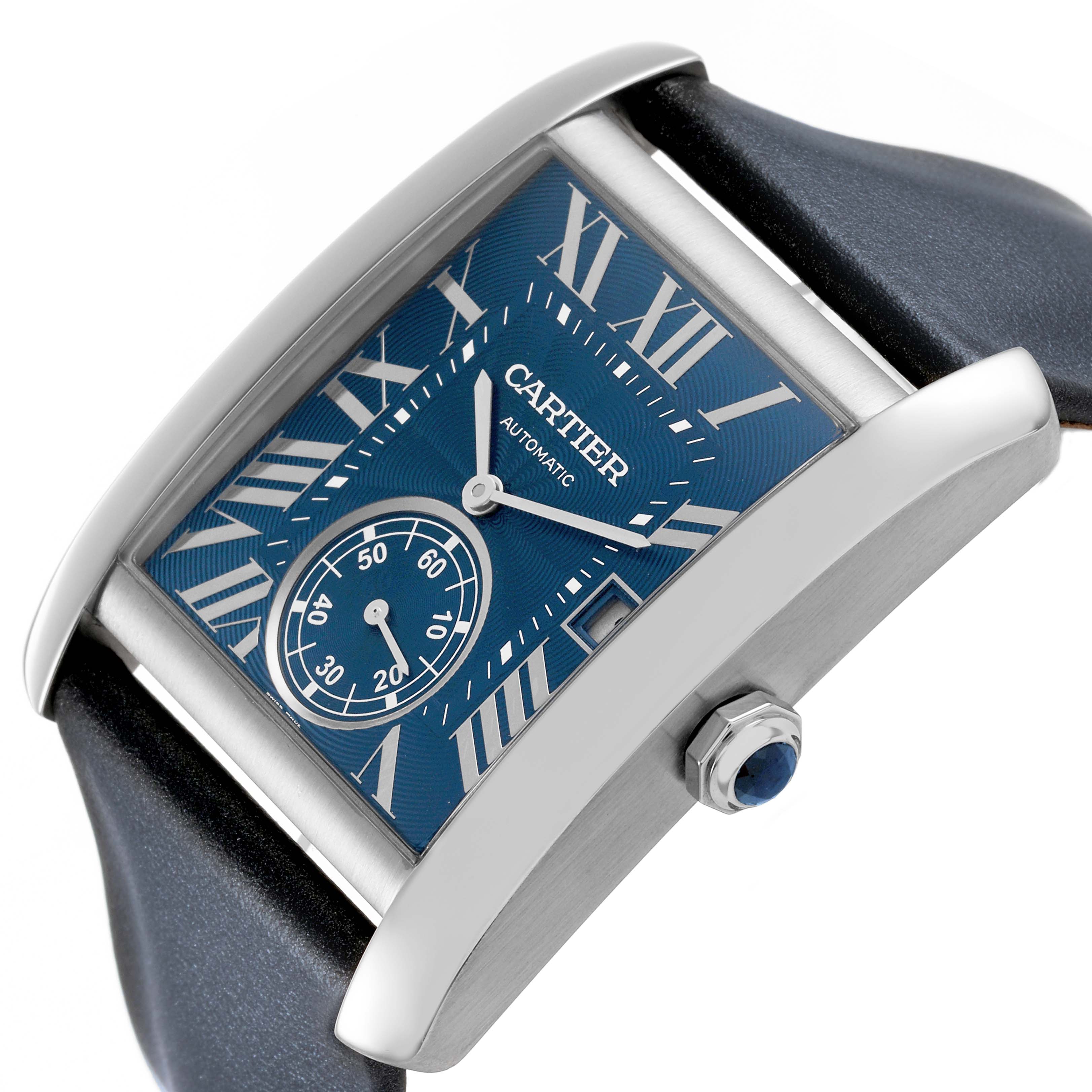 The Cartier Tank MC WSTA0010 Men's Stainless Steel Blue Dial watch is angled to show its blue dial, Roman numerals, sub-dial, and crown with a blue cabochon.