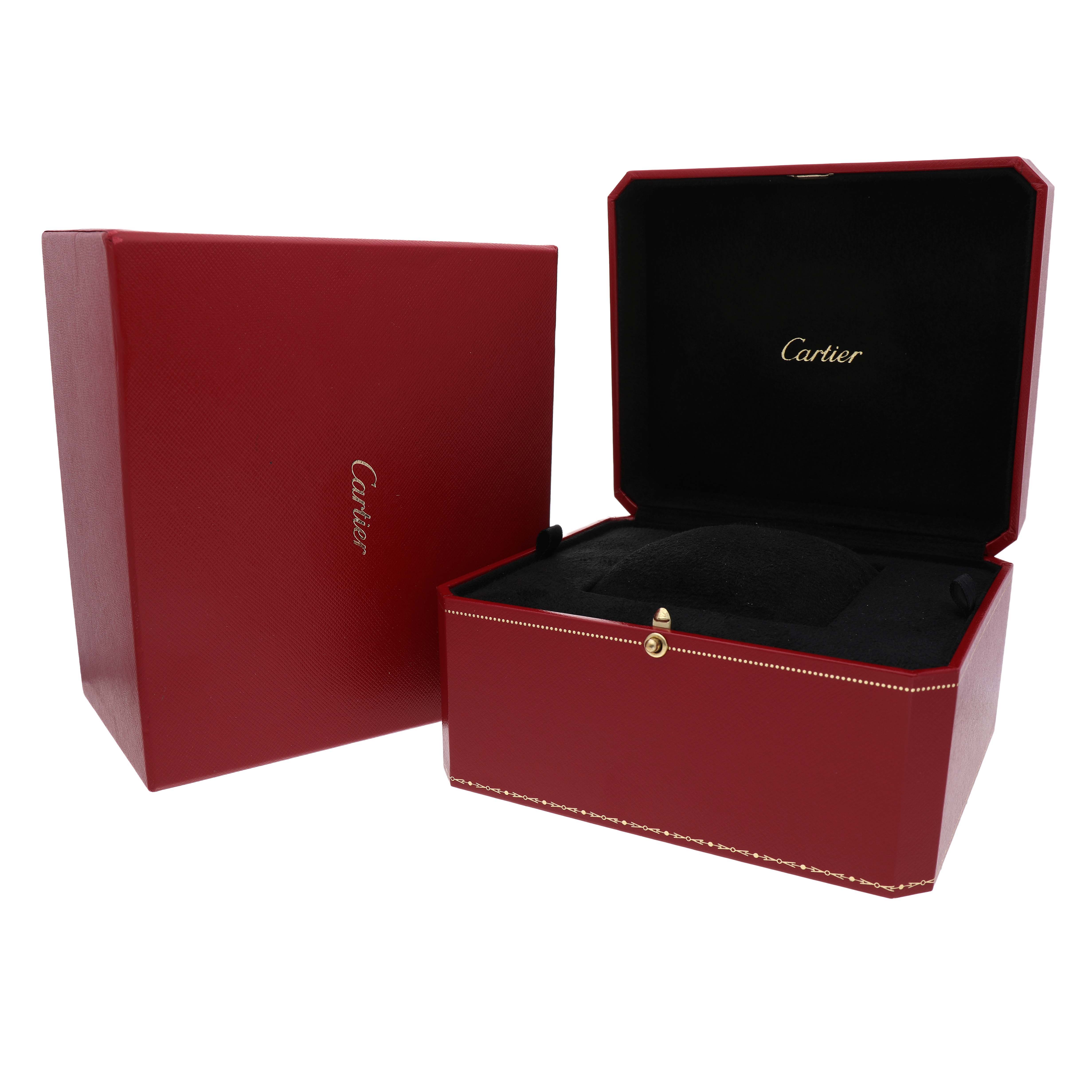 The image shows the Tortue model by Cartier's red watch box, open to display the interior cushion.