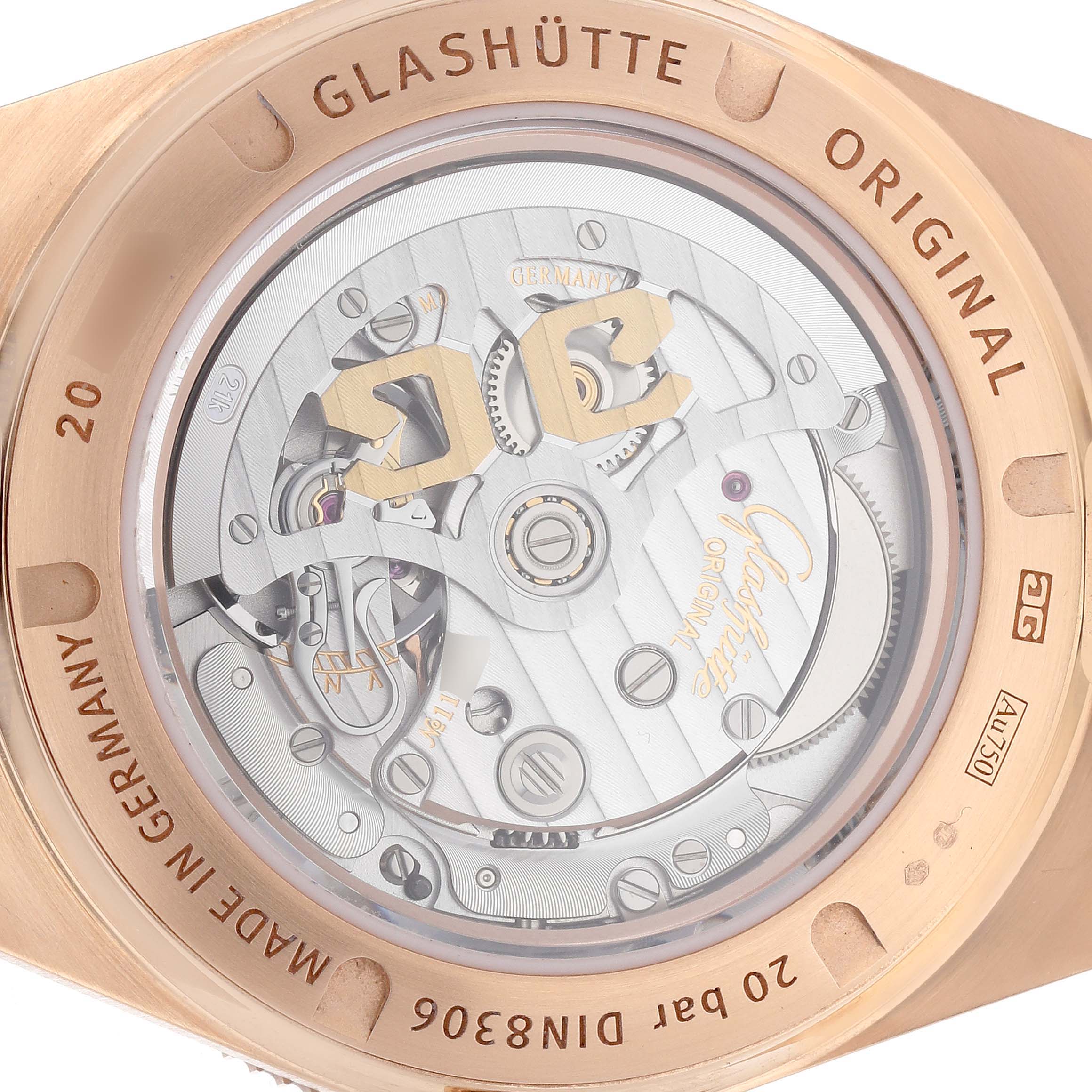 The image shows the Glashütte Original watch from the back, displaying its mechanical movement and transparent case back.