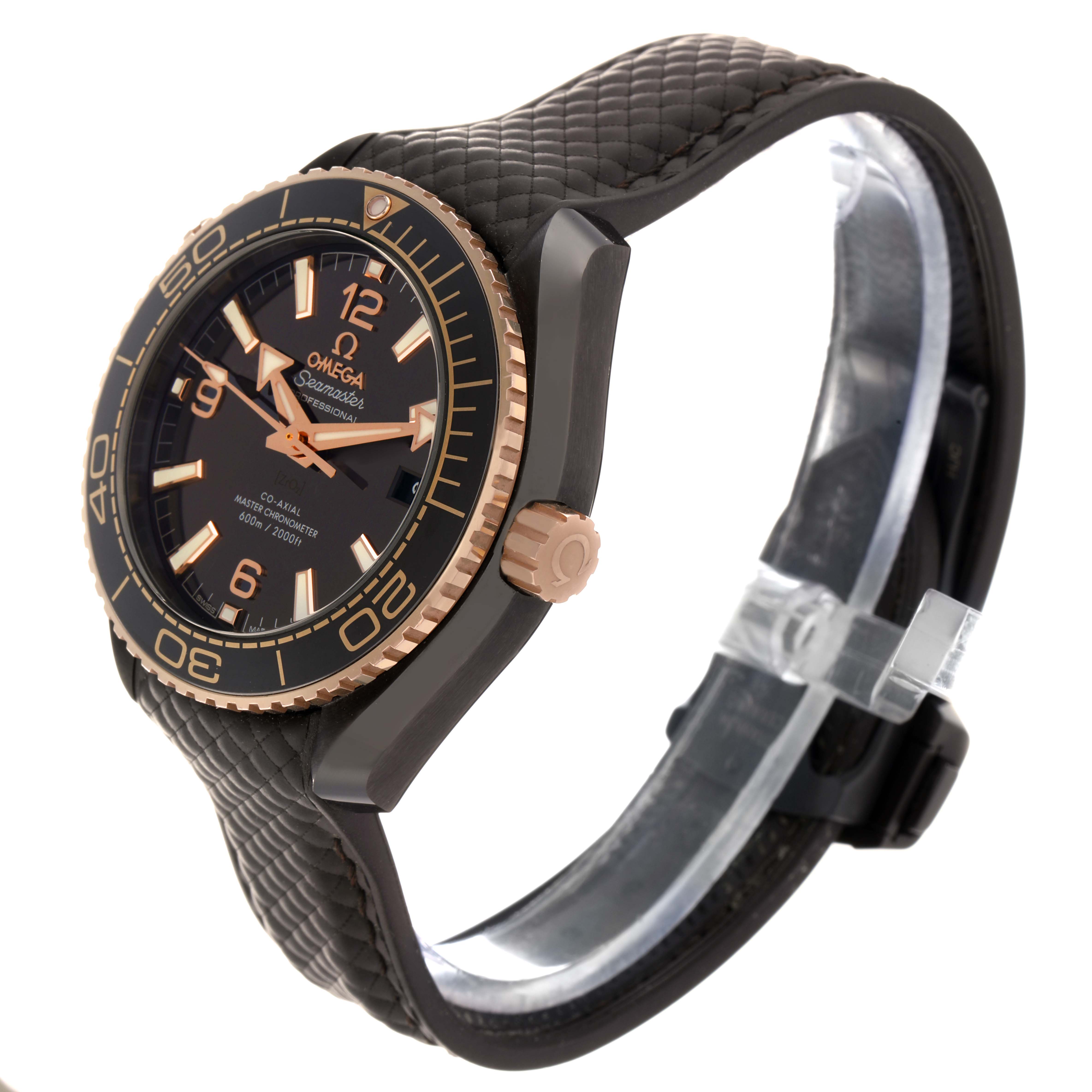 The Omega Planet Ocean 215.62.40.20.13.001 Men
s Rose Gold Black Dial watch is shown at an angled side view, highlighting the bezel, dial, and textured strap.