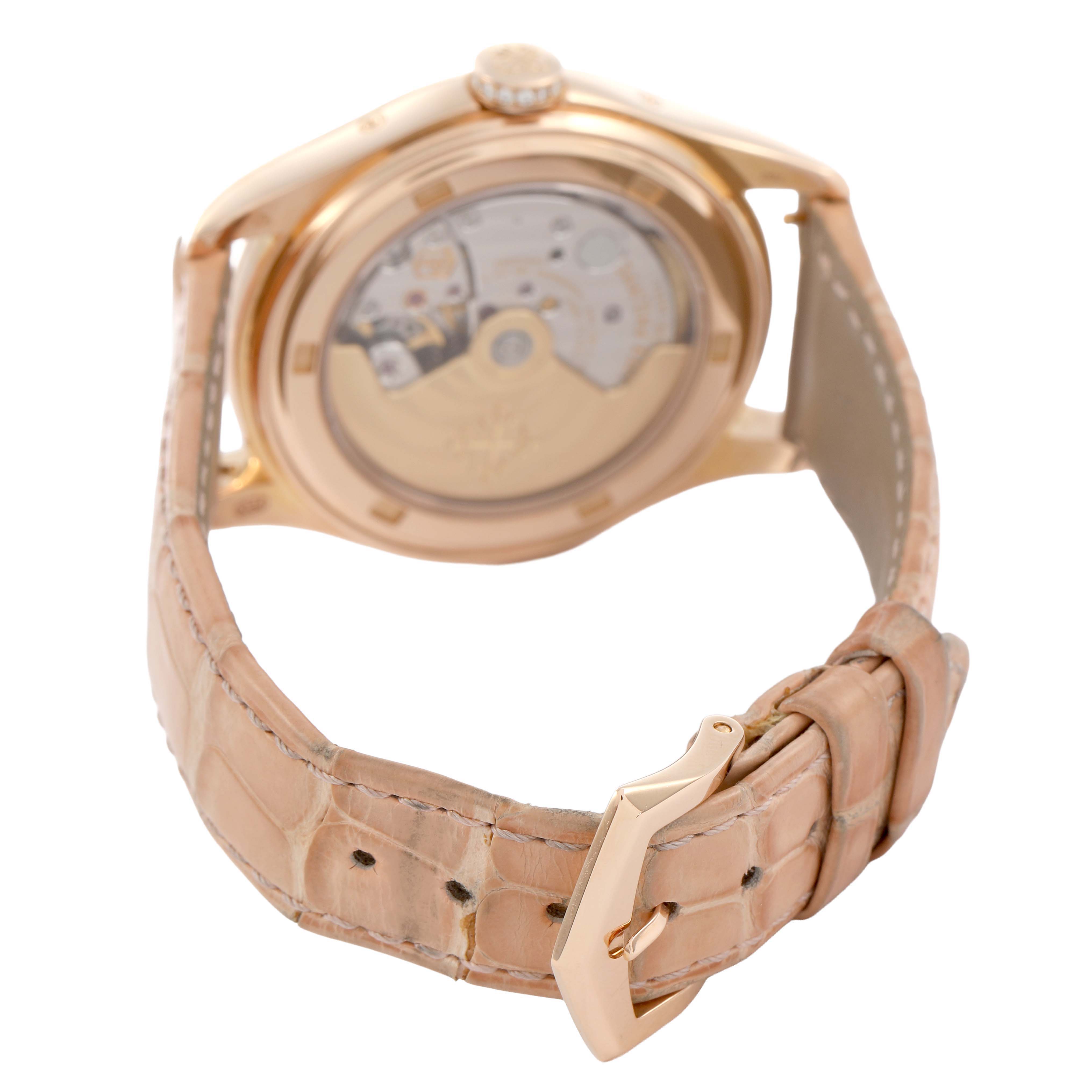 The Patek Philippe Complications 4936R-001 Men's Rose Gold Mother of Pearl Dial watch is shown from the back, highlighting its transparent case back and leather strap.