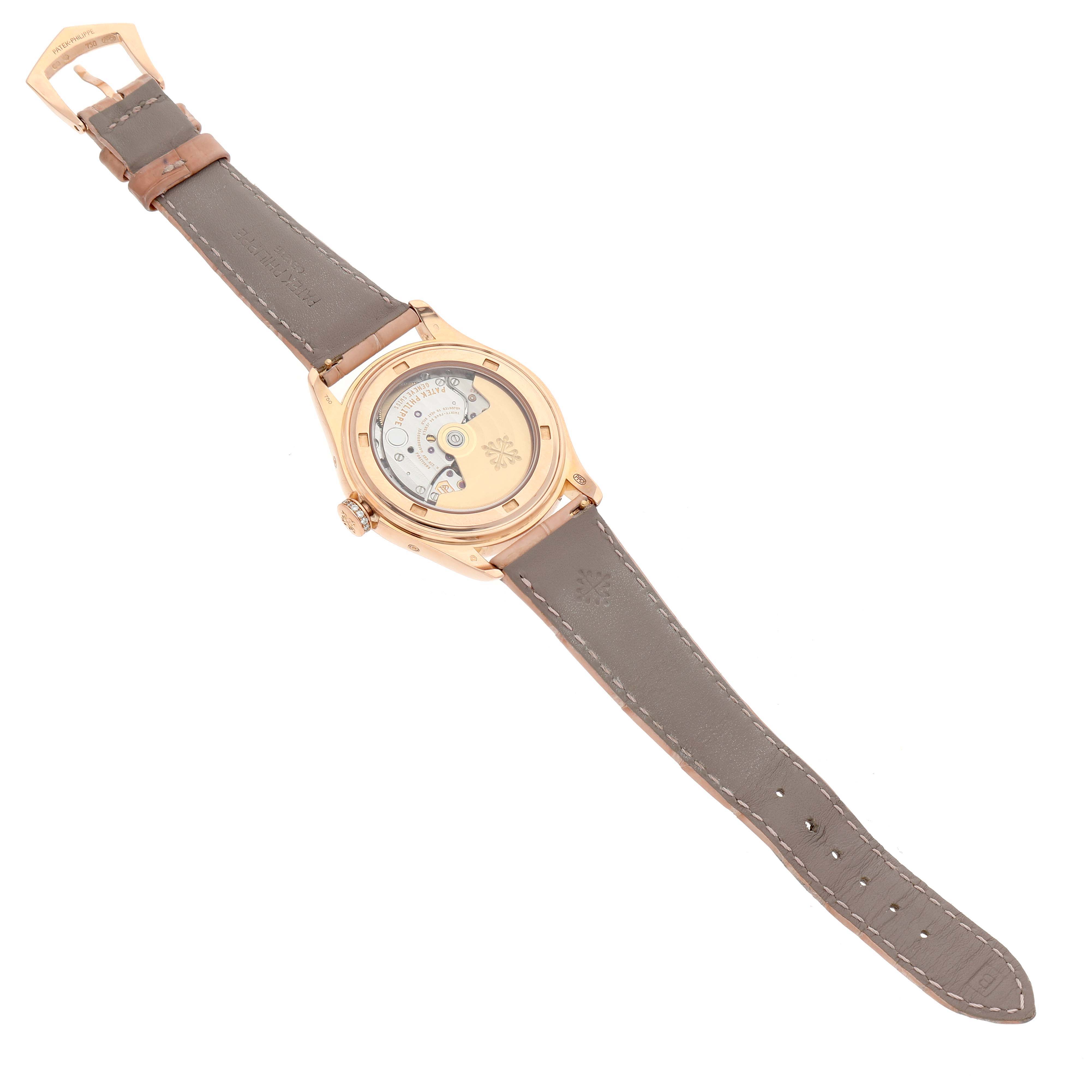 The image shows the back view of the Patek Philippe Complications 4936R-001 Men's Rose Gold Mother of Pearl Dial model, highlighting its open case back and leather strap.