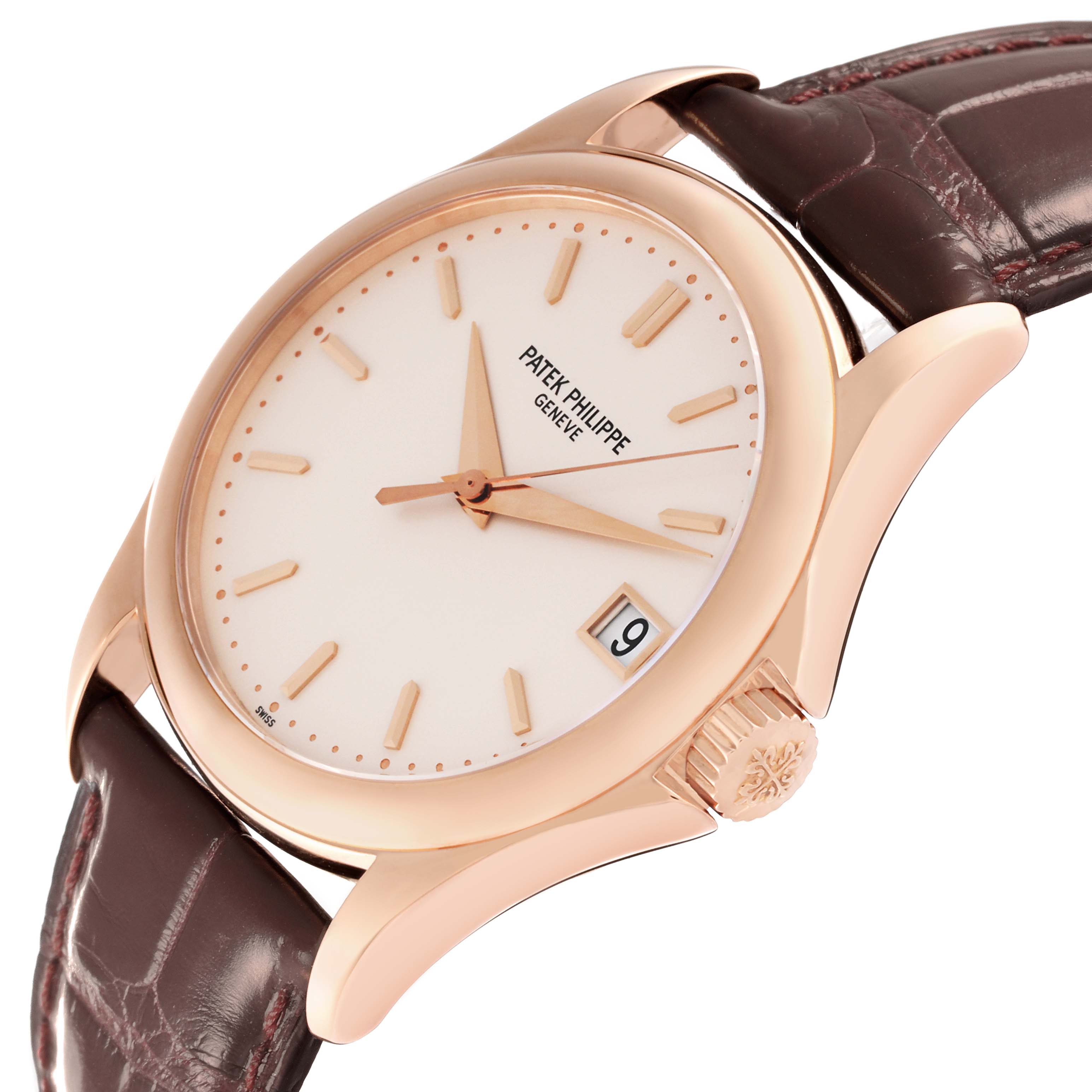 The image shows a side angle of a Patek Philippe Calatrava 5127R-001 Men's Rose Gold Silver Dial 5127R-001 Men's Rose Gold Silver Dial watch, highlighting the dial, crown, and brown leather strap.