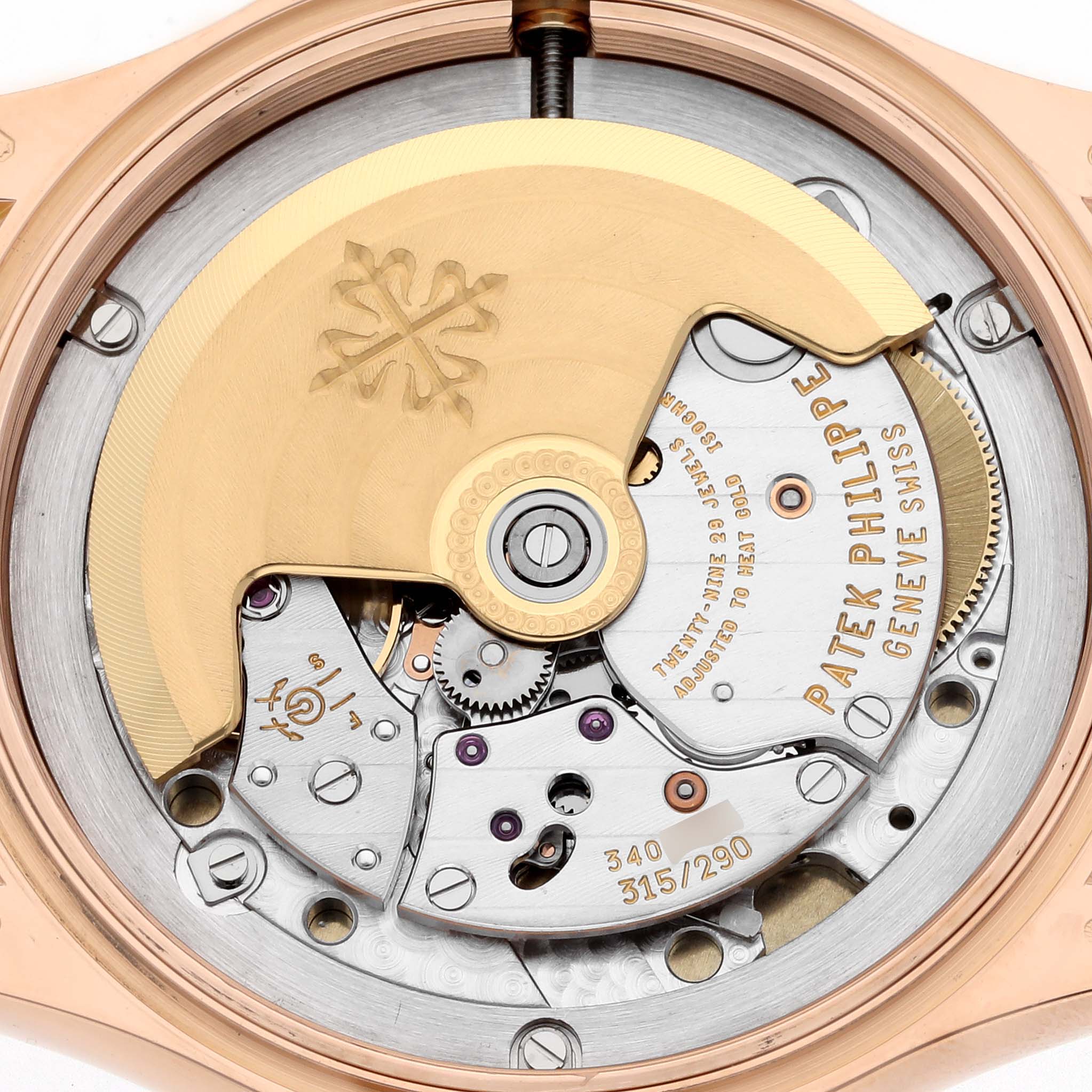 The image shows the movement and intricate mechanisms of the Patek Philippe Calatrava 5127R-001 Men's Rose Gold Silver Dial 5127R-001 Men's Rose Gold Silver Dial watch viewed from the back.