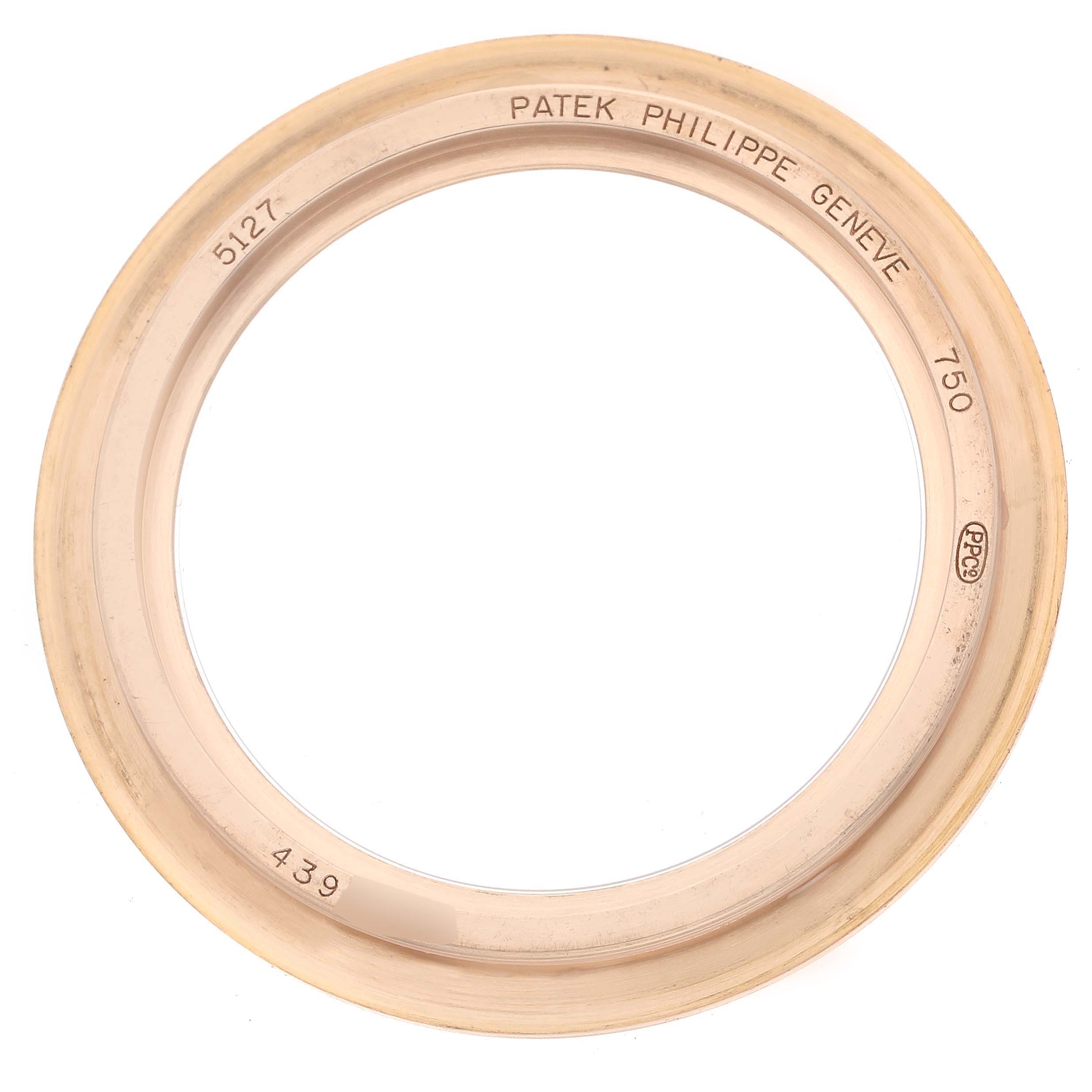 The image shows the bezel of a Patek Philippe Calatrava 5127R-001 Men's Rose Gold Silver Dial 5127R-001 Men's Rose Gold Silver Dial model watch, viewed from the front.