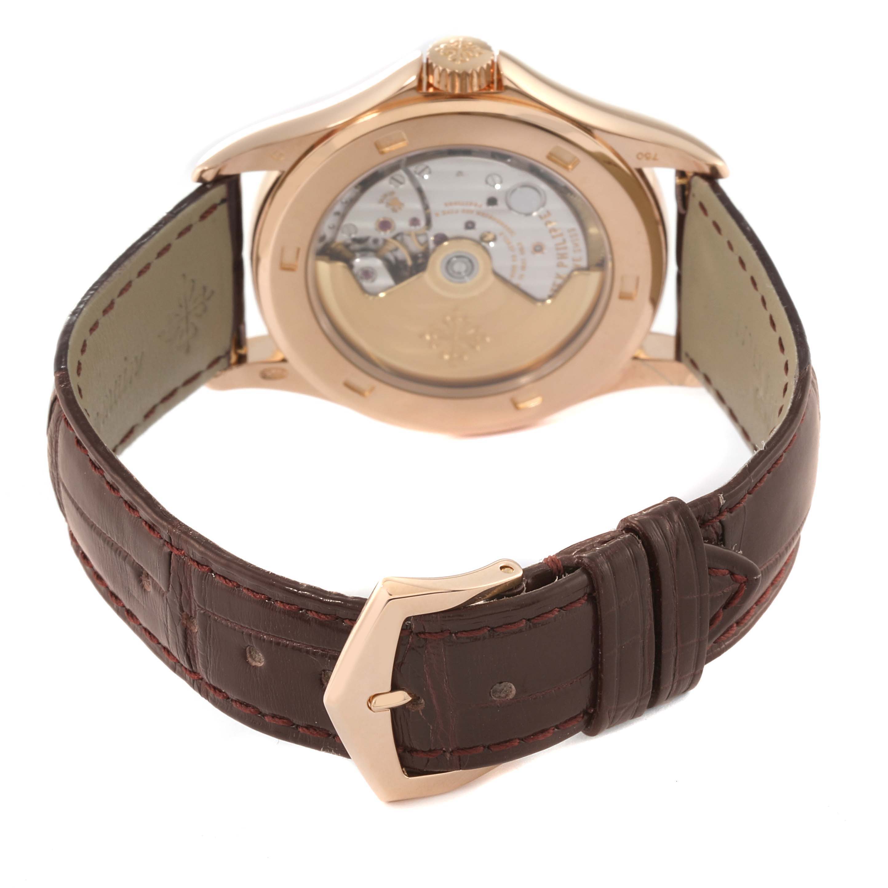 The image shows the back side of a Patek Philippe Calatrava 5127R-001 Men's Rose Gold Silver Dial 5127R-001 Men's Rose Gold Silver Dial watch, highlighting the movement and brown leather strap.