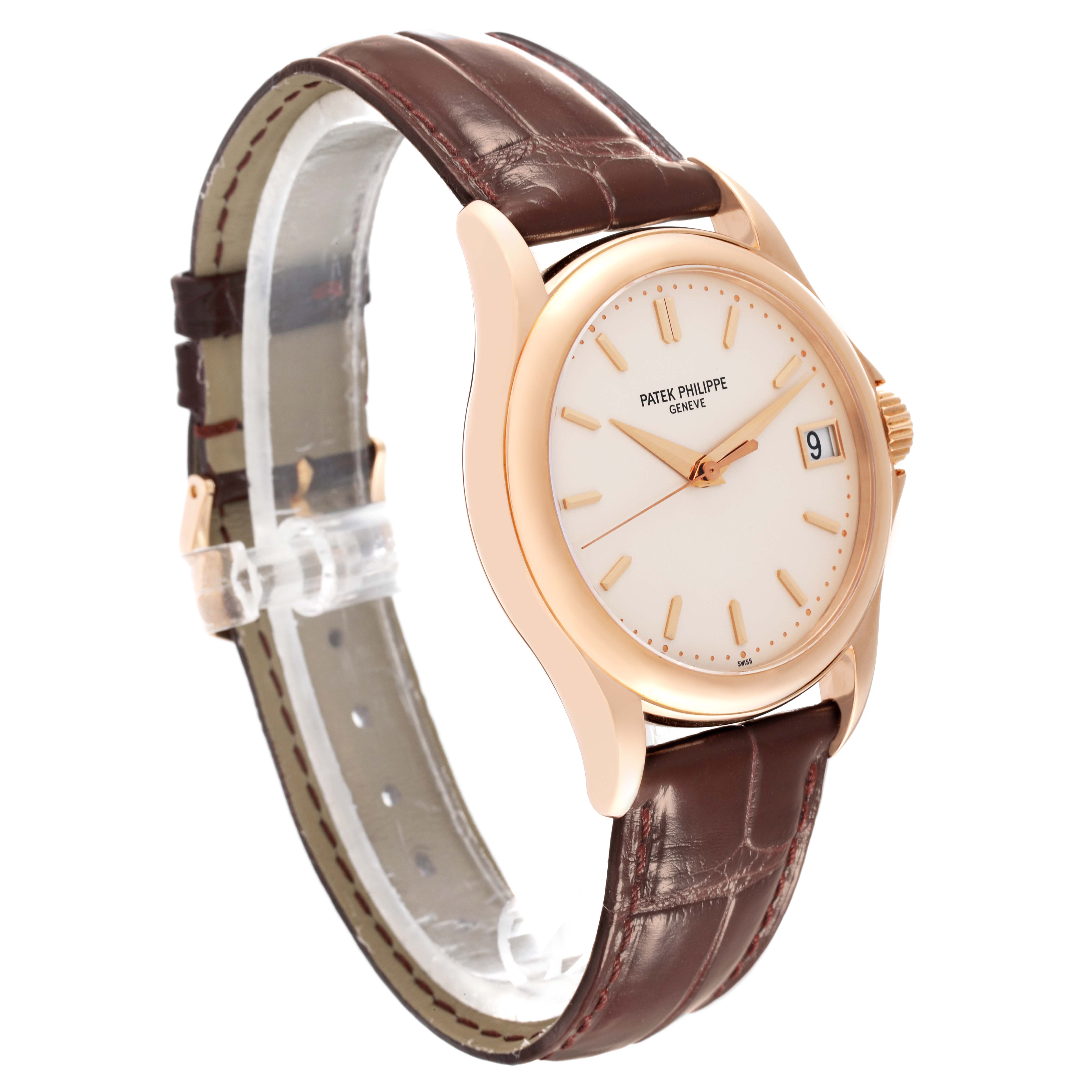 The image shows a Patek Philippe Calatrava 5127R-001 Men's Rose Gold Silver Dial 5127R-001 Men's Rose Gold Silver Dial watch at a three-quarter angle, highlighting the face, bezel, case, and leather strap.