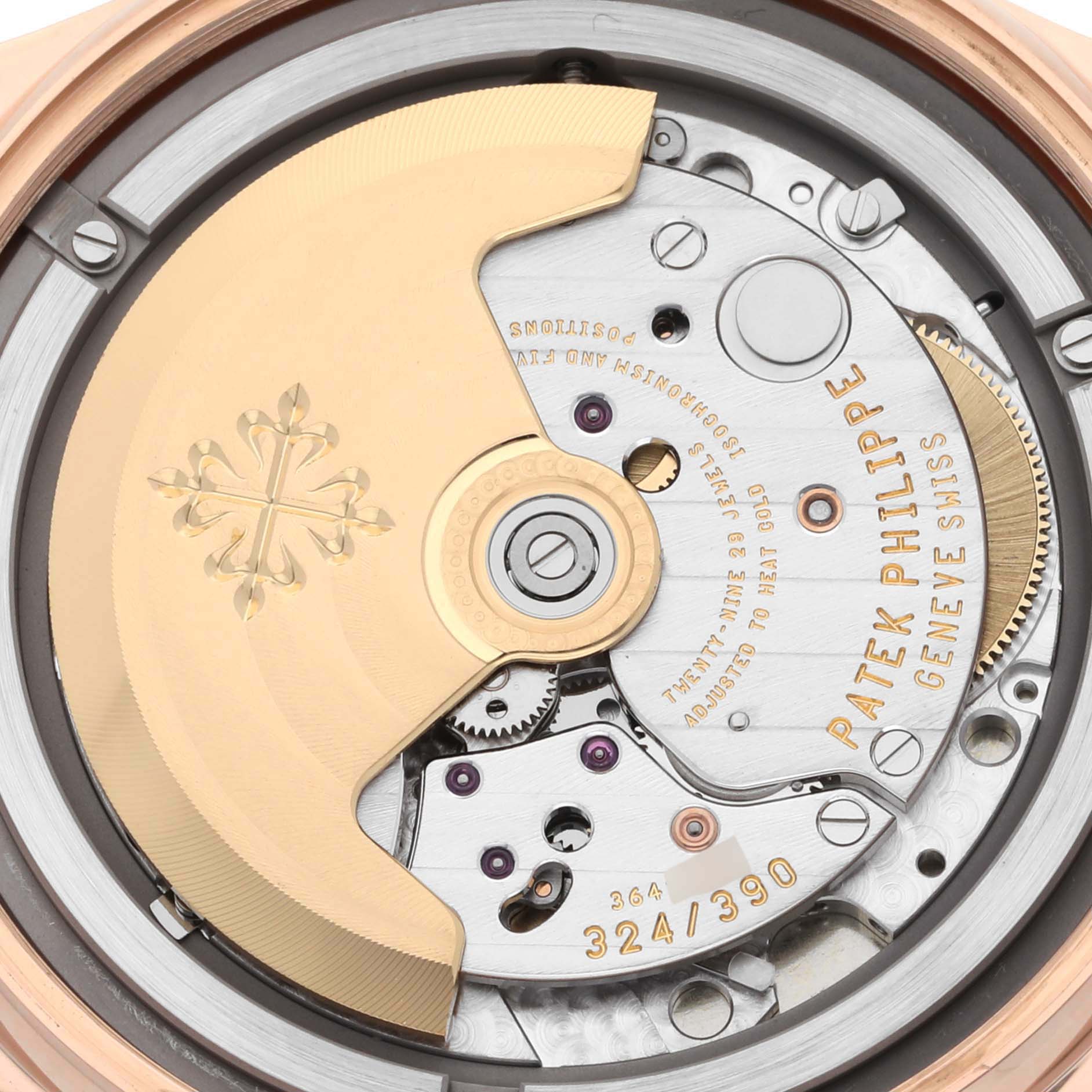 The image shows a close-up view of the movement mechanism of a Patek Philippe Calatrava 5296R-010 Men's Rose Gold Silver Dial 5296R-010 Men's Rose Gold Silver Dial watch, highlighting the rotor and various inner components.