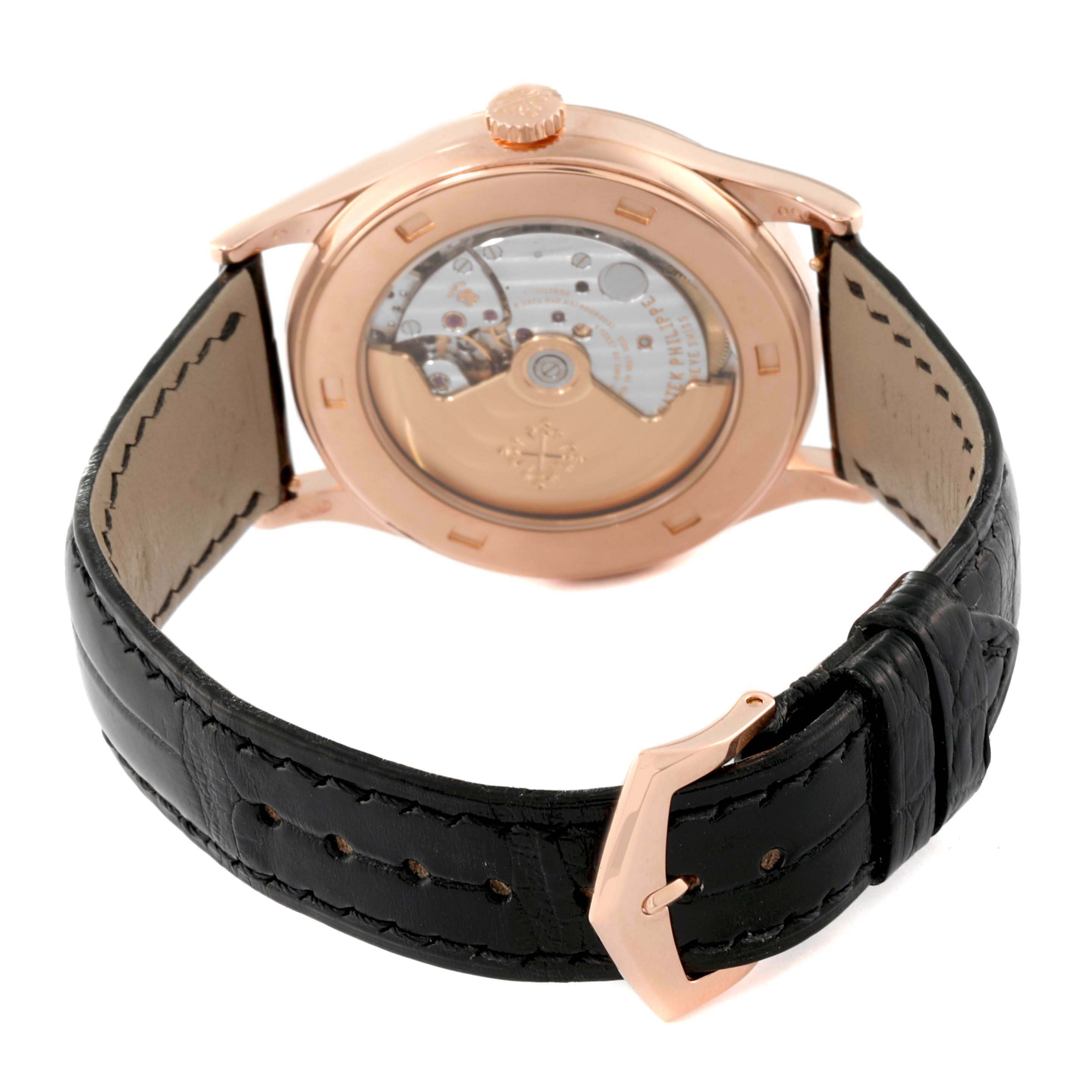 This image shows the back view of a Patek Philippe Calatrava 5296R-010 Men's Rose Gold Silver Dial 5296R-010 Men's Rose Gold Silver Dial watch, highlighting its movement and leather strap.