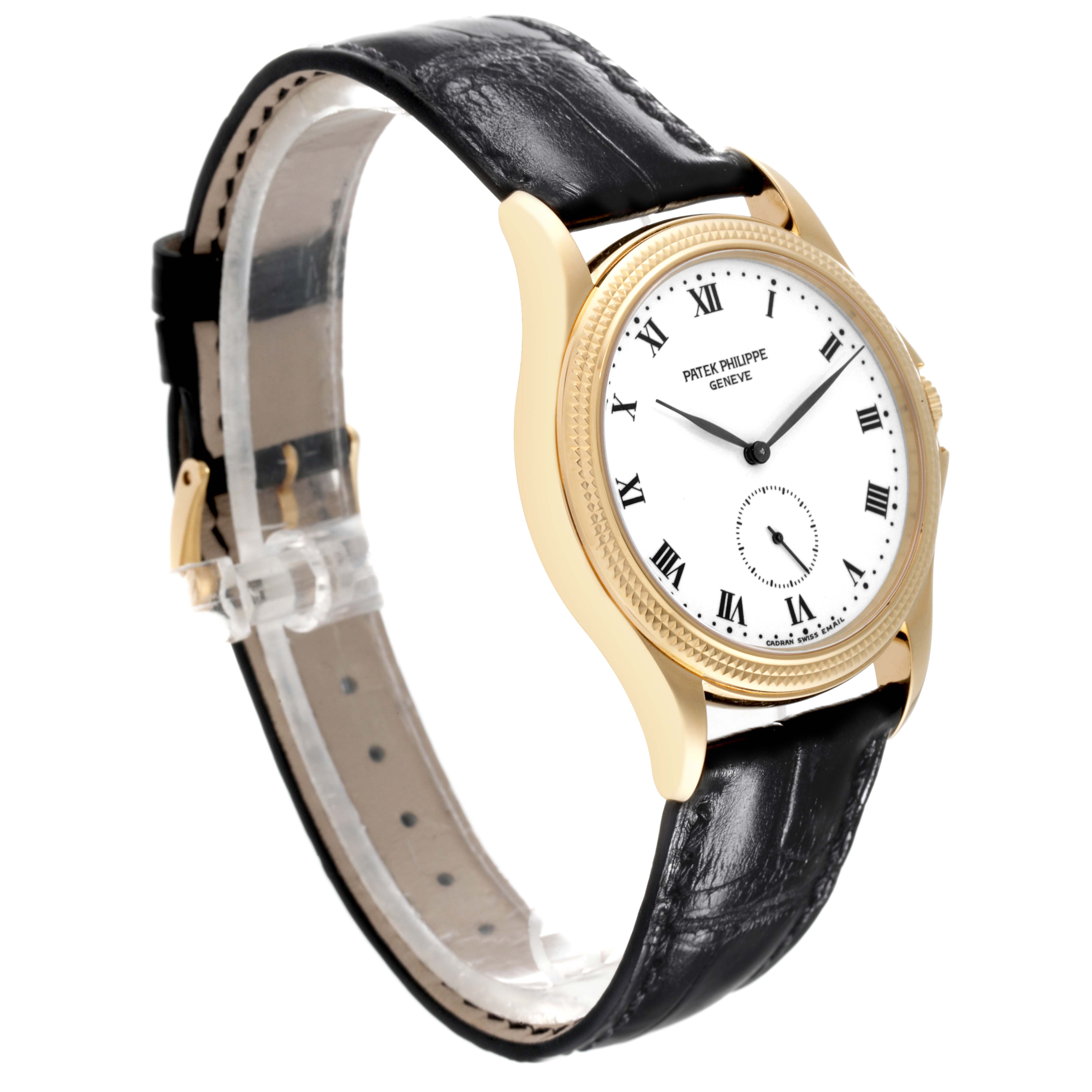 The image shows a side angle view of a Patek Philippe Calatrava 5115J Men's Yellow Gold White Dial 5115J Men's Yellow Gold White Dial watch, featuring its white dial, golden case, and black leather strap.