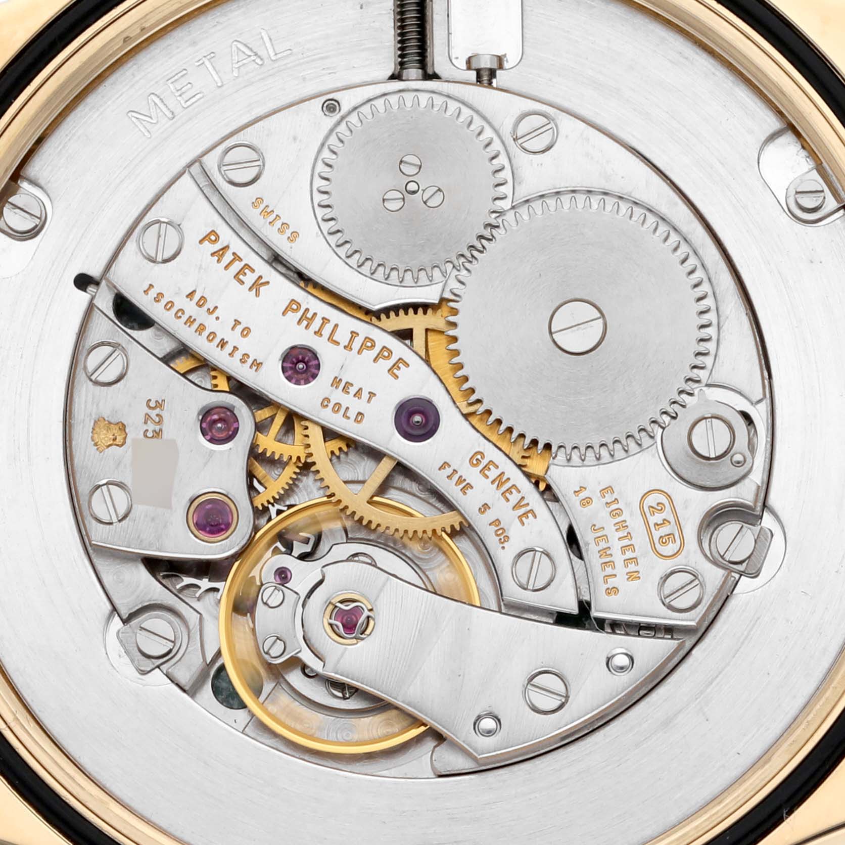 The image shows the intricate movement parts of the Patek Philippe Calatrava 5115J Men's Yellow Gold White Dial 5115J Men's Yellow Gold White Dial watch from a close-up, detailed back view.