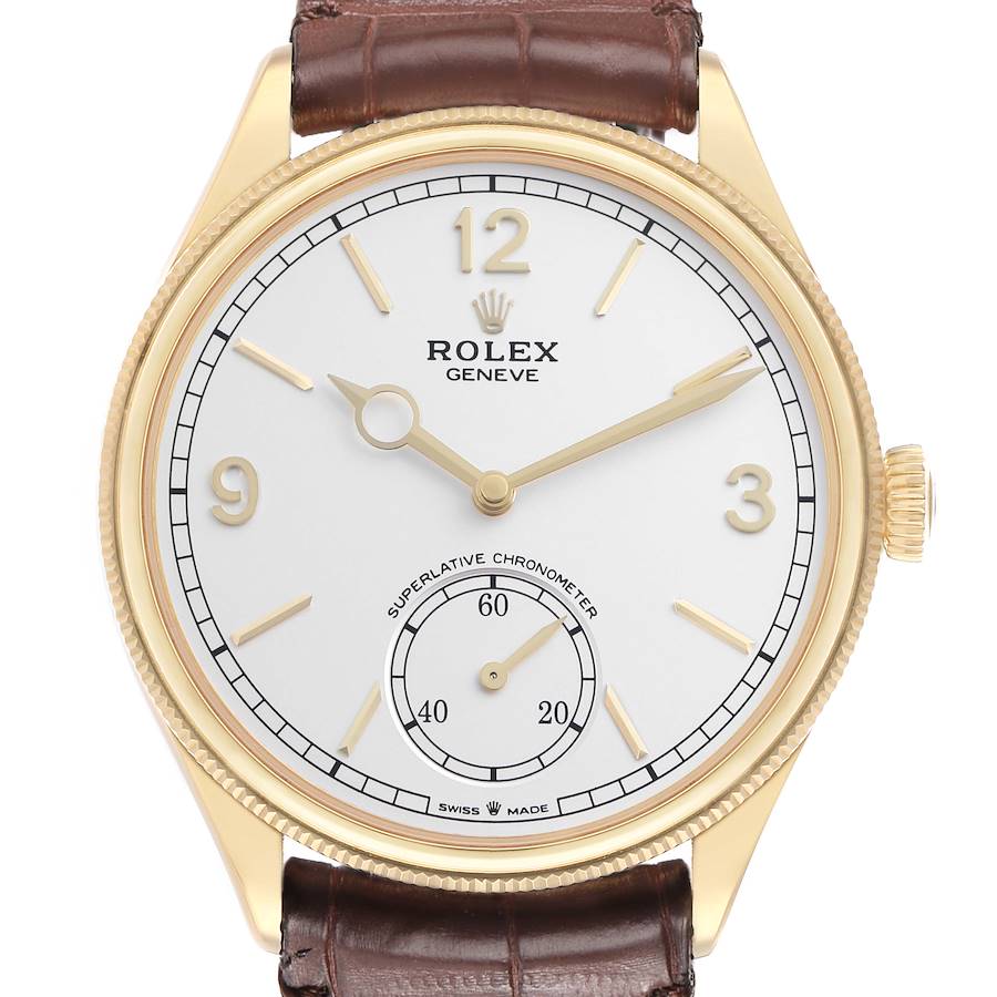 The Rolex 1908 52508-0006 Men's Yellow Gold White Dial model is shown from the front, displaying the dial, hands, and crown, with a brown leather strap.