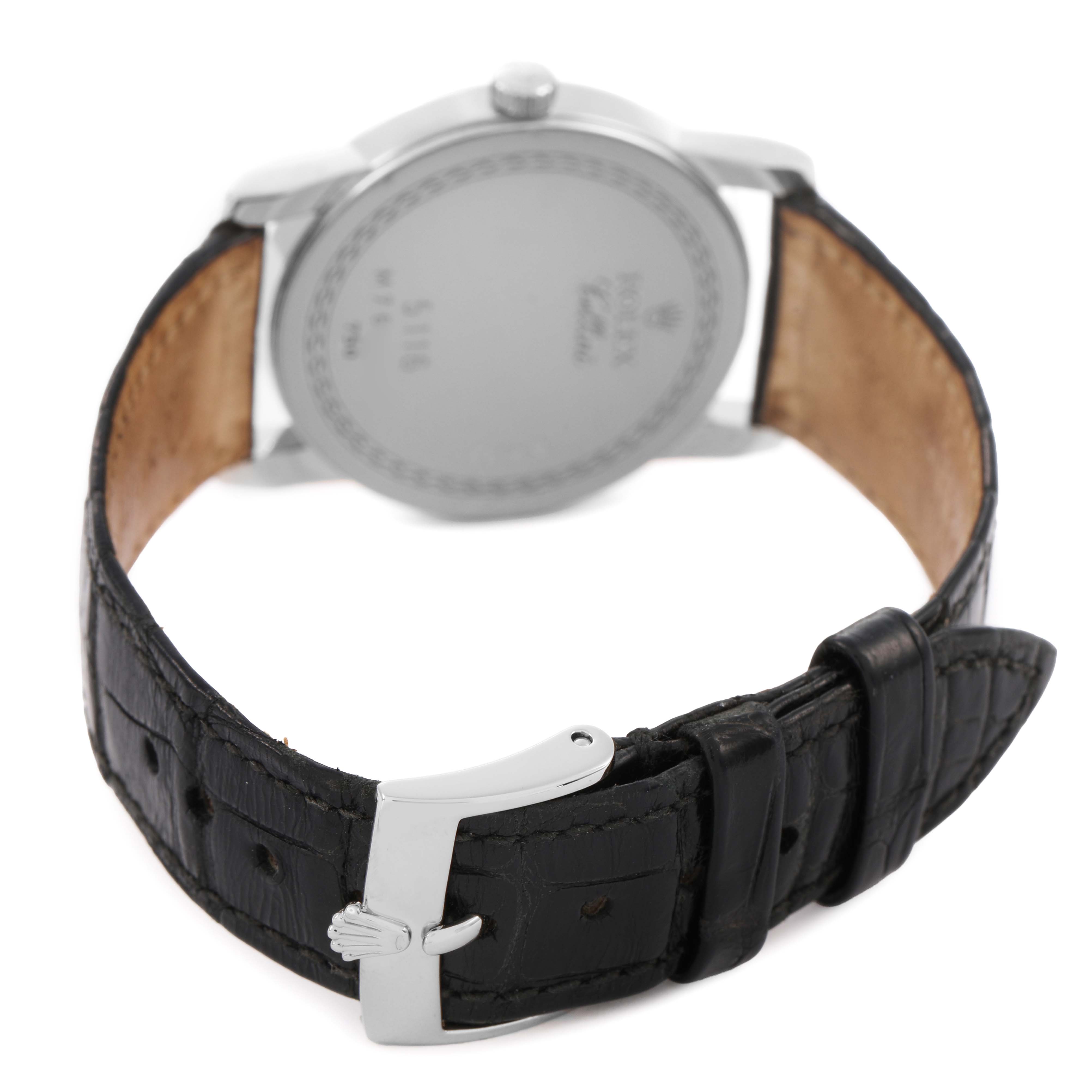 The Rolex Cellini 5116/9 Men's White Gold White Dial watch is shown from the back, highlighting the case back, leather strap, and metal clasp.