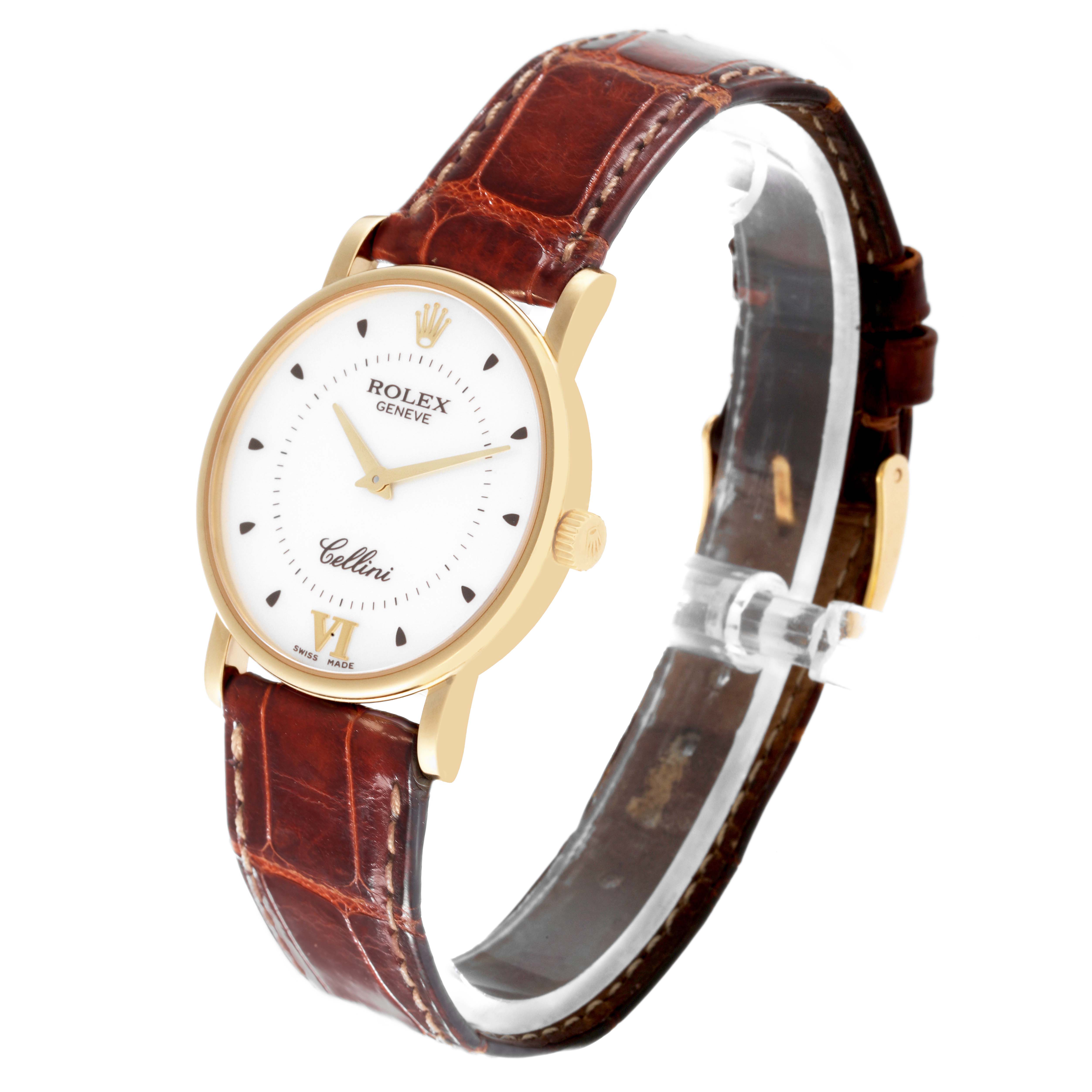 The Rolex Cellini 5115 Men's Yellow Gold Silver Dial 5115 Men's Yellow Gold Silver Dial watch is shown at a slight angle featuring its face, brown leather strap, and gold case.